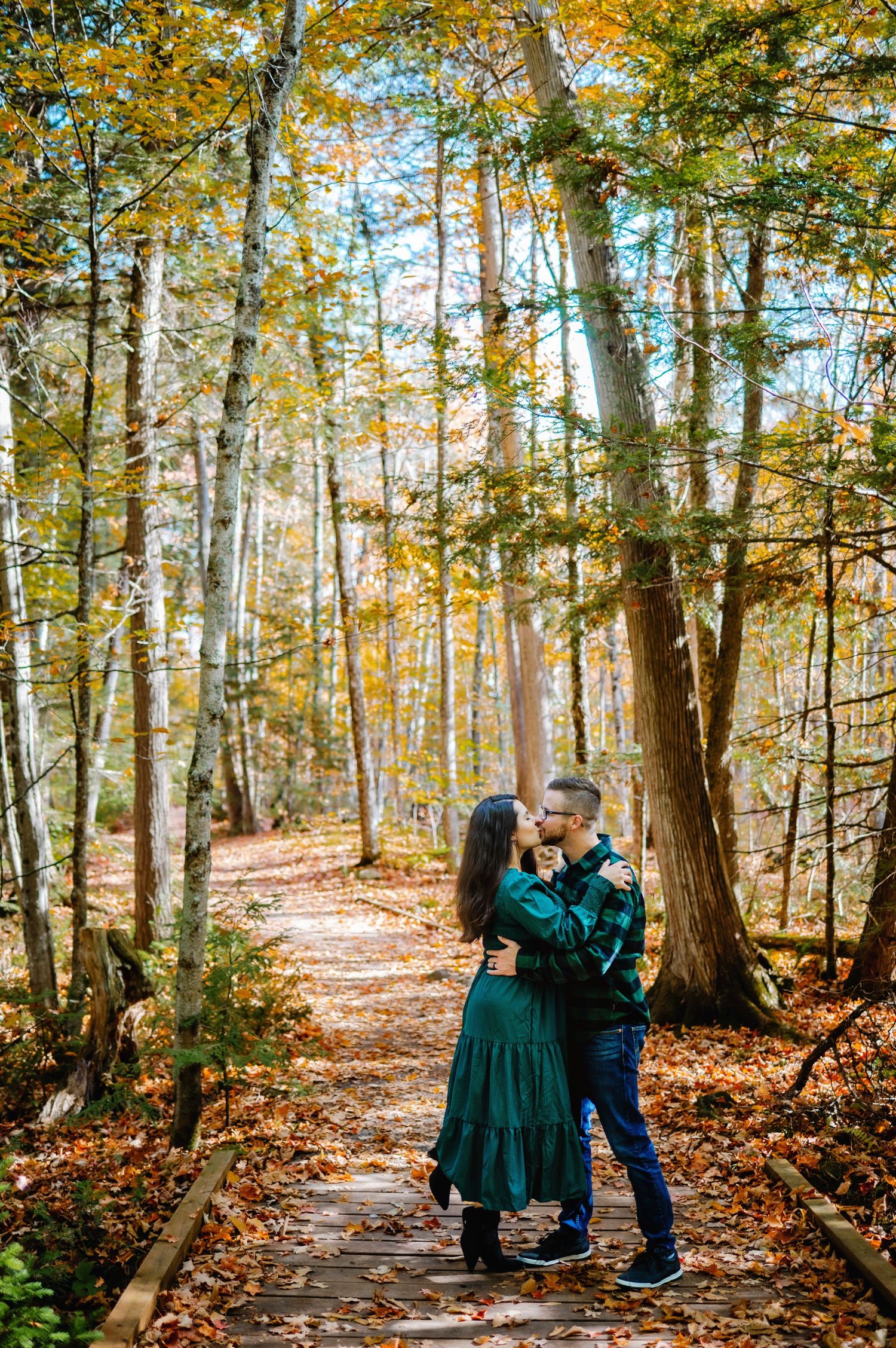 Couple dancing upon the fall leaves. Ottawa Couples Photographer. Ottawa Fall Mini's Photography
