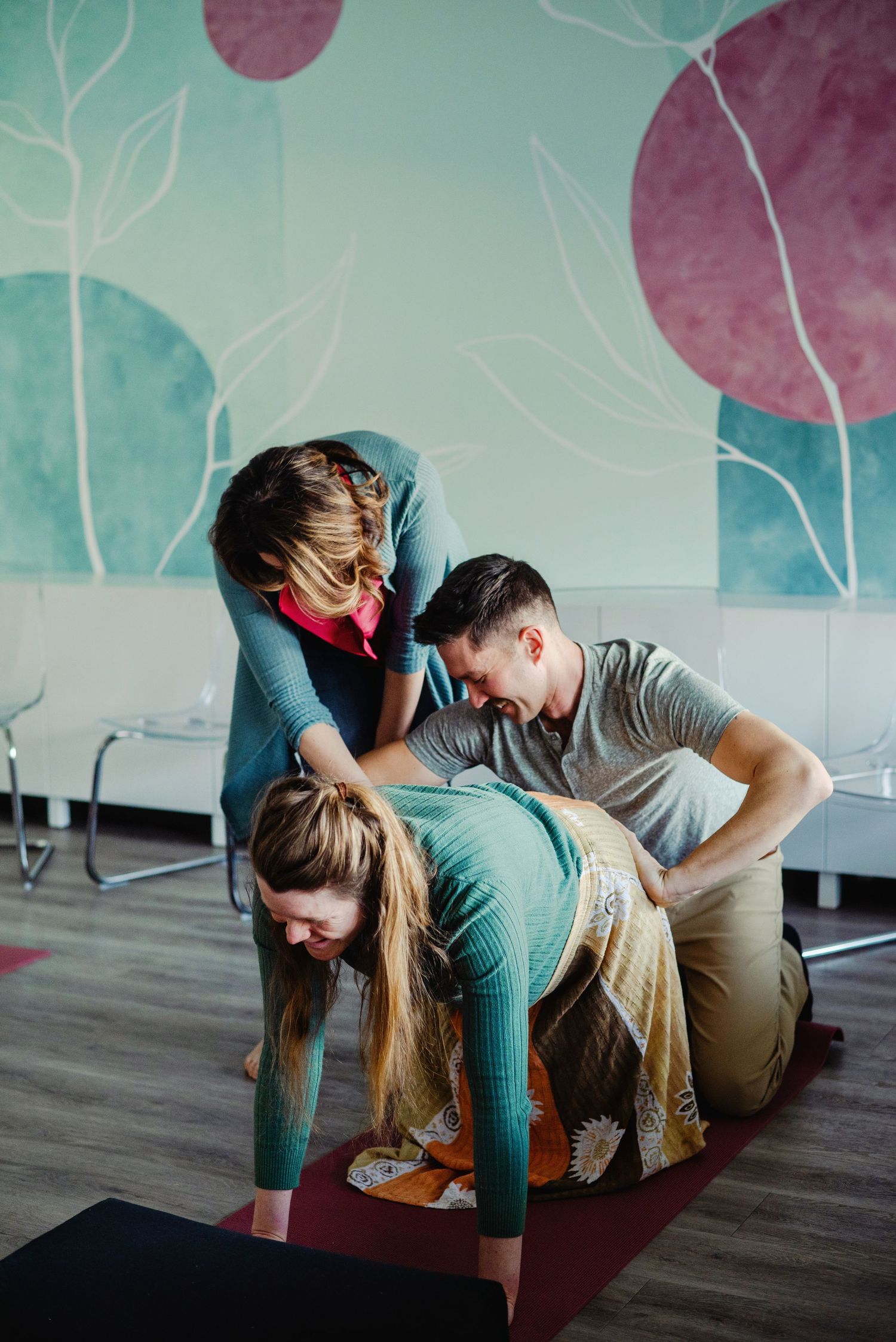 Branding photography doula demonstrating pregnancy stretches  . Ottawa Branding Photographer