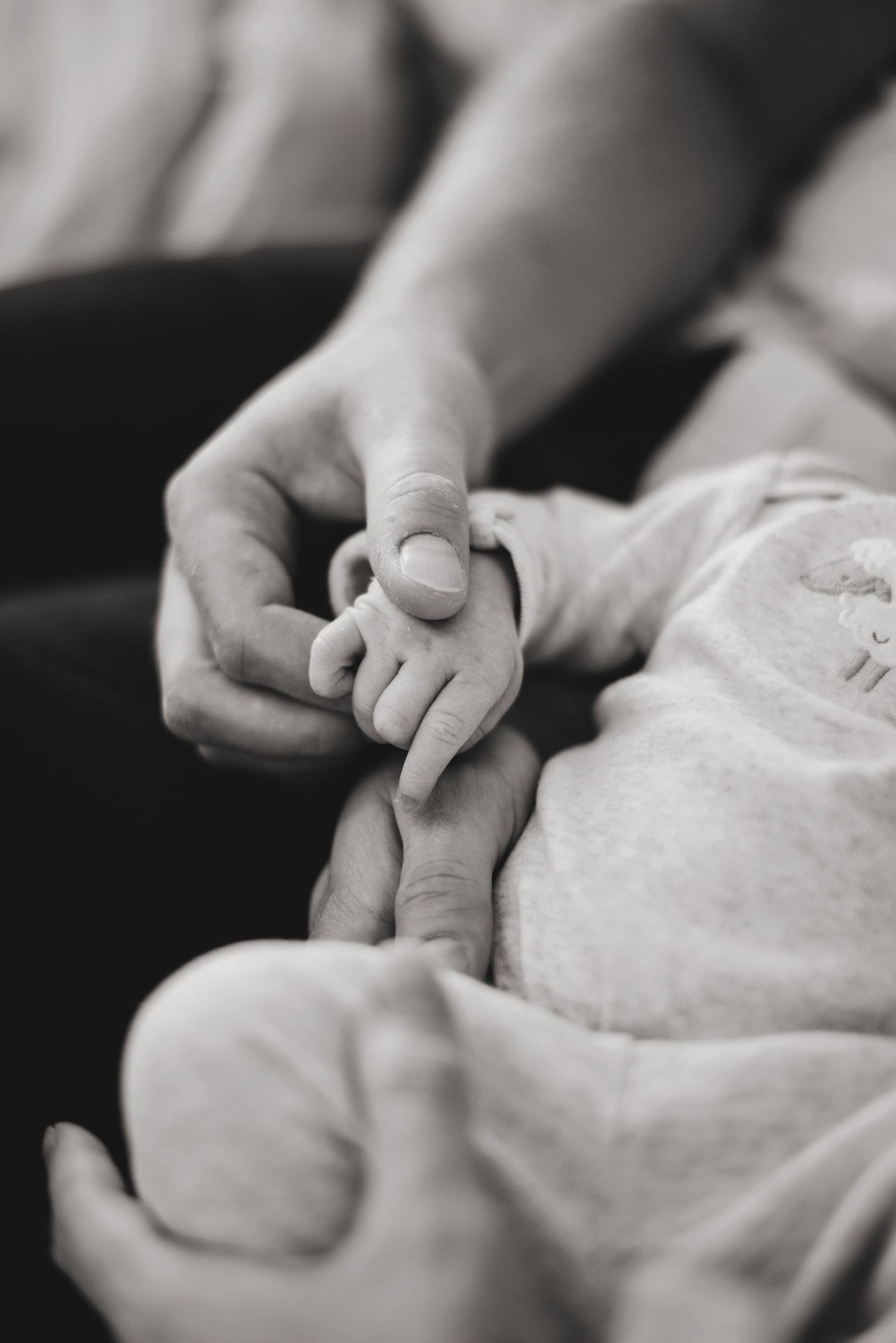 Dad holding newborn daughters hand. Ottawa Newborn Photography. Ottawa Family Photography.