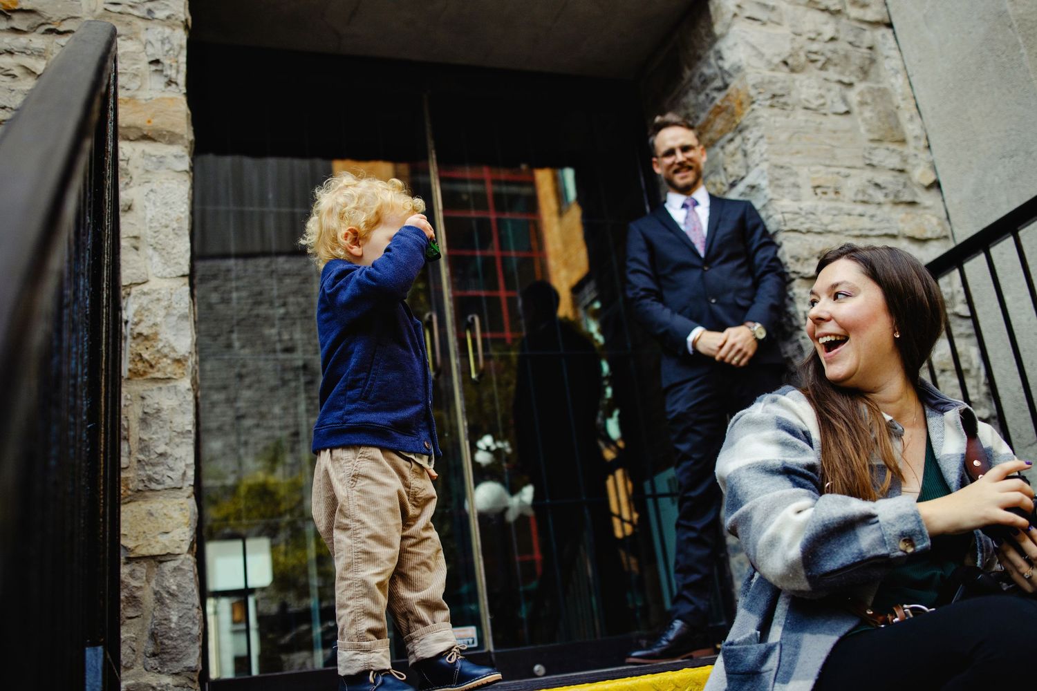 Shauna laughing with wedding guest. Ottawa Wedding Photographer and Videographer
