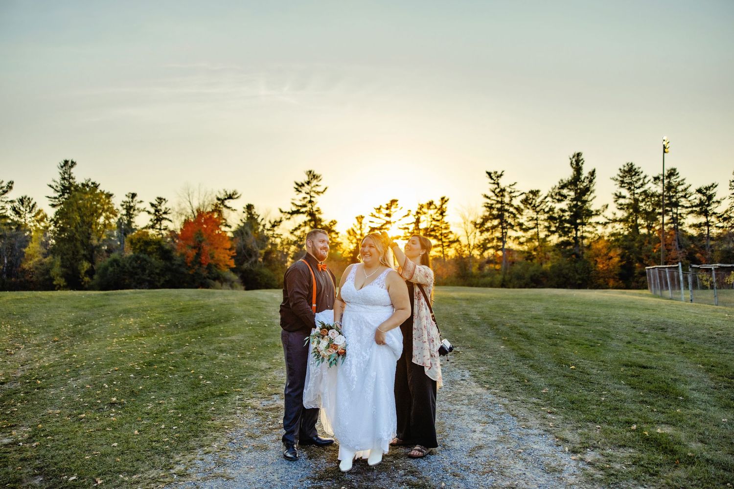 Shauna helping bride take veil out. Ottawa Wedding Photography. Ottawa Wedding Videography.