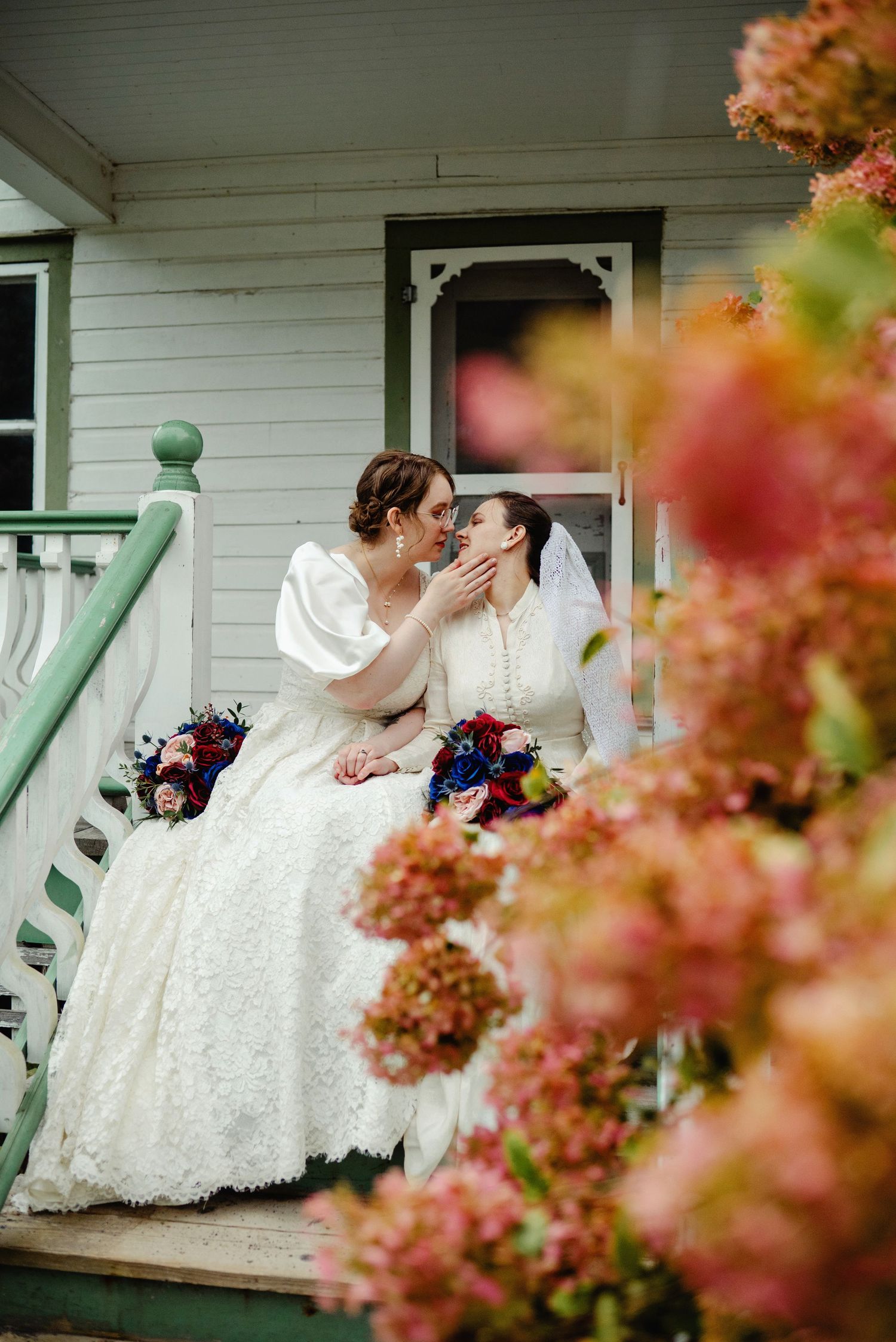 Bride kissing their bride on the porch steps. Ottawa Wedding Photography. Ottawa Wedding Videography.