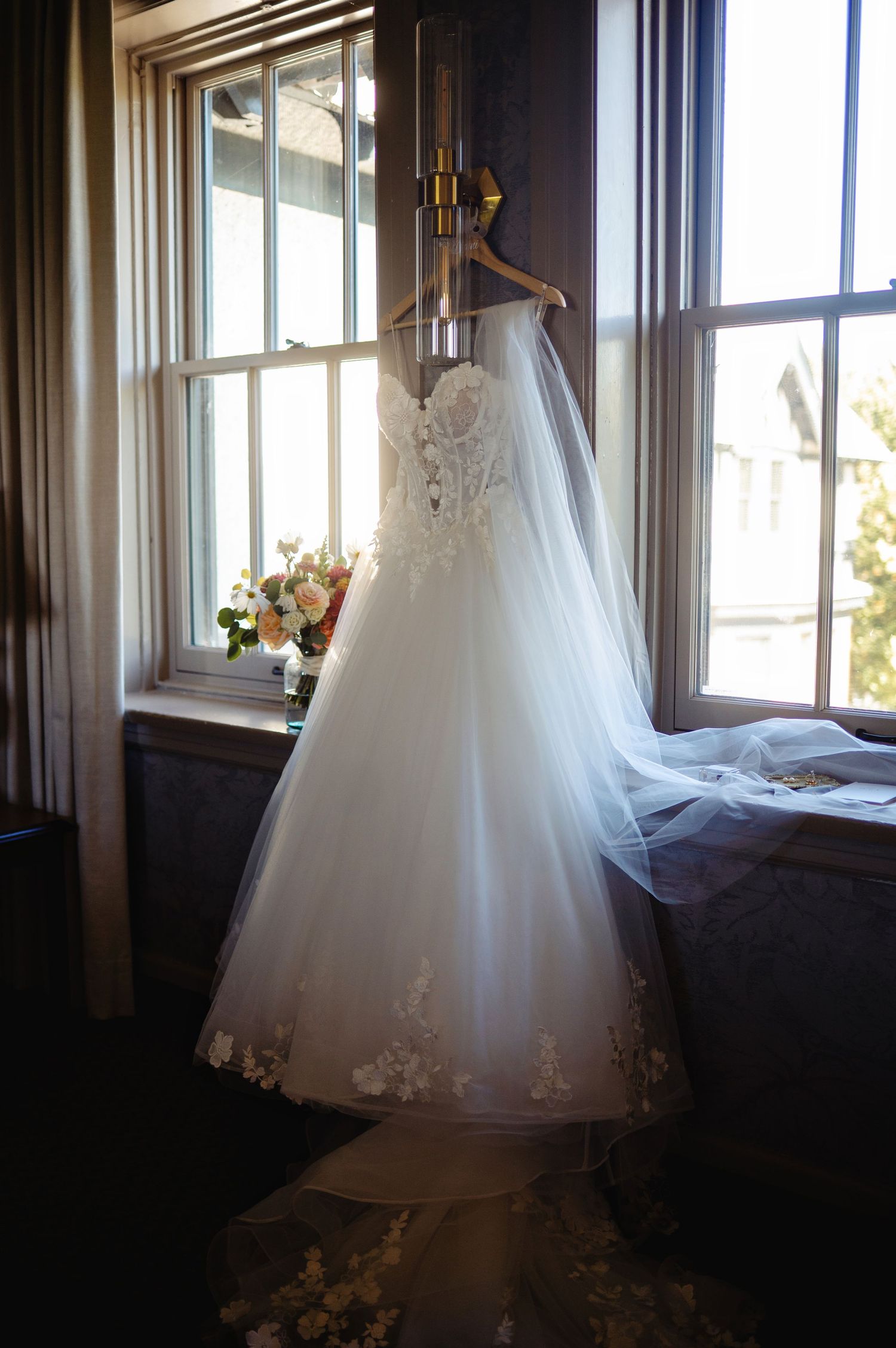 Brides dress hanging. Ottawa Wedding Photography. Ottawa Wedding Videography.
