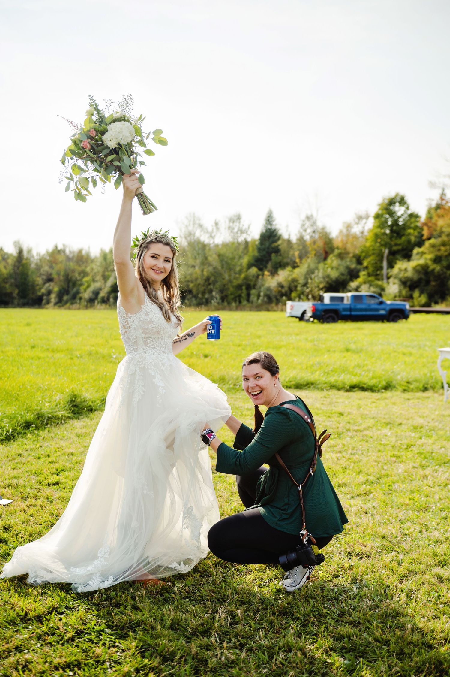 Shauna helping adjust brides dress. Ottawa Wedding Photographer and Videographer