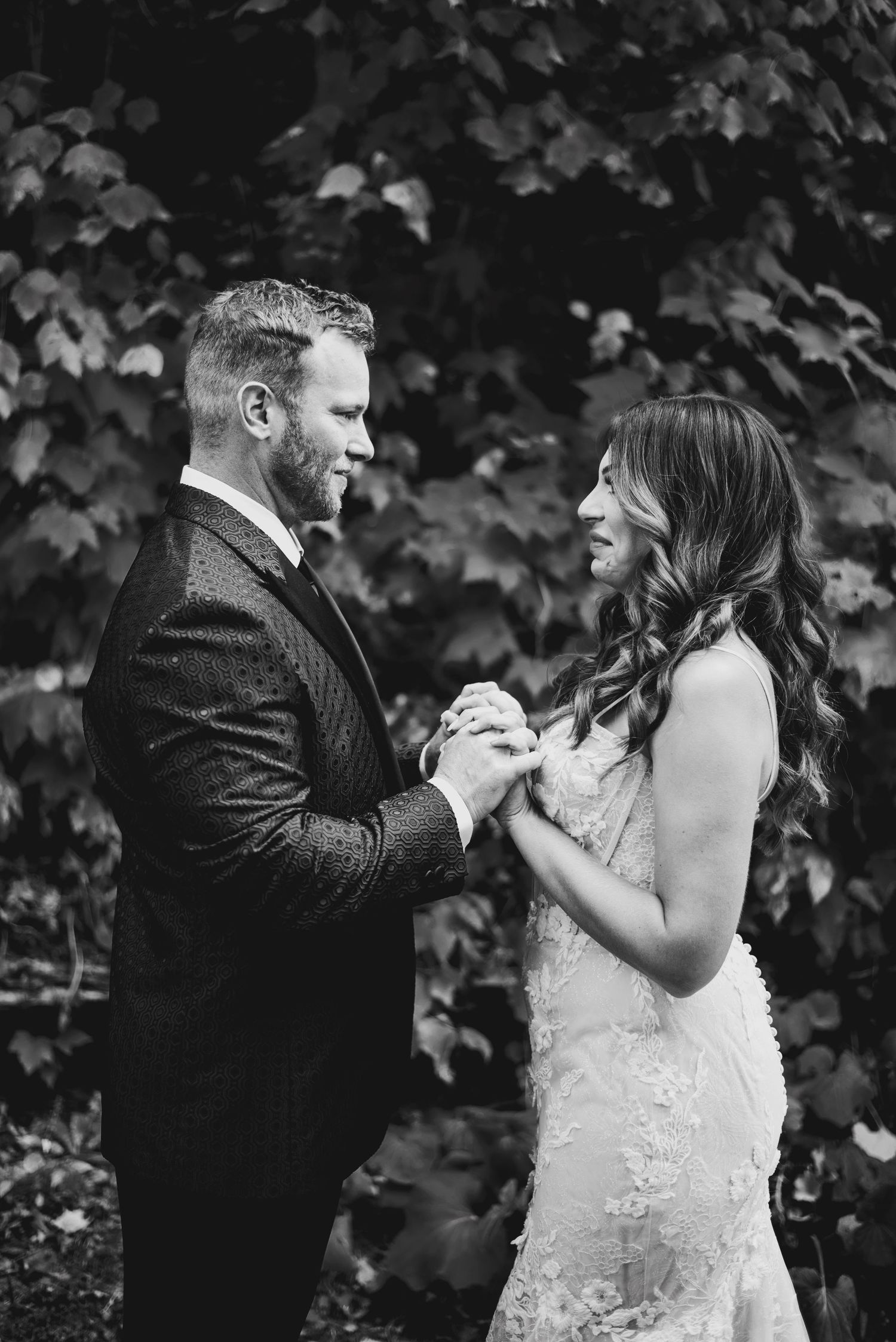 Groom holding brides hands during first look. Ottawa Wedding Photography. Ottawa Wedding Videography.