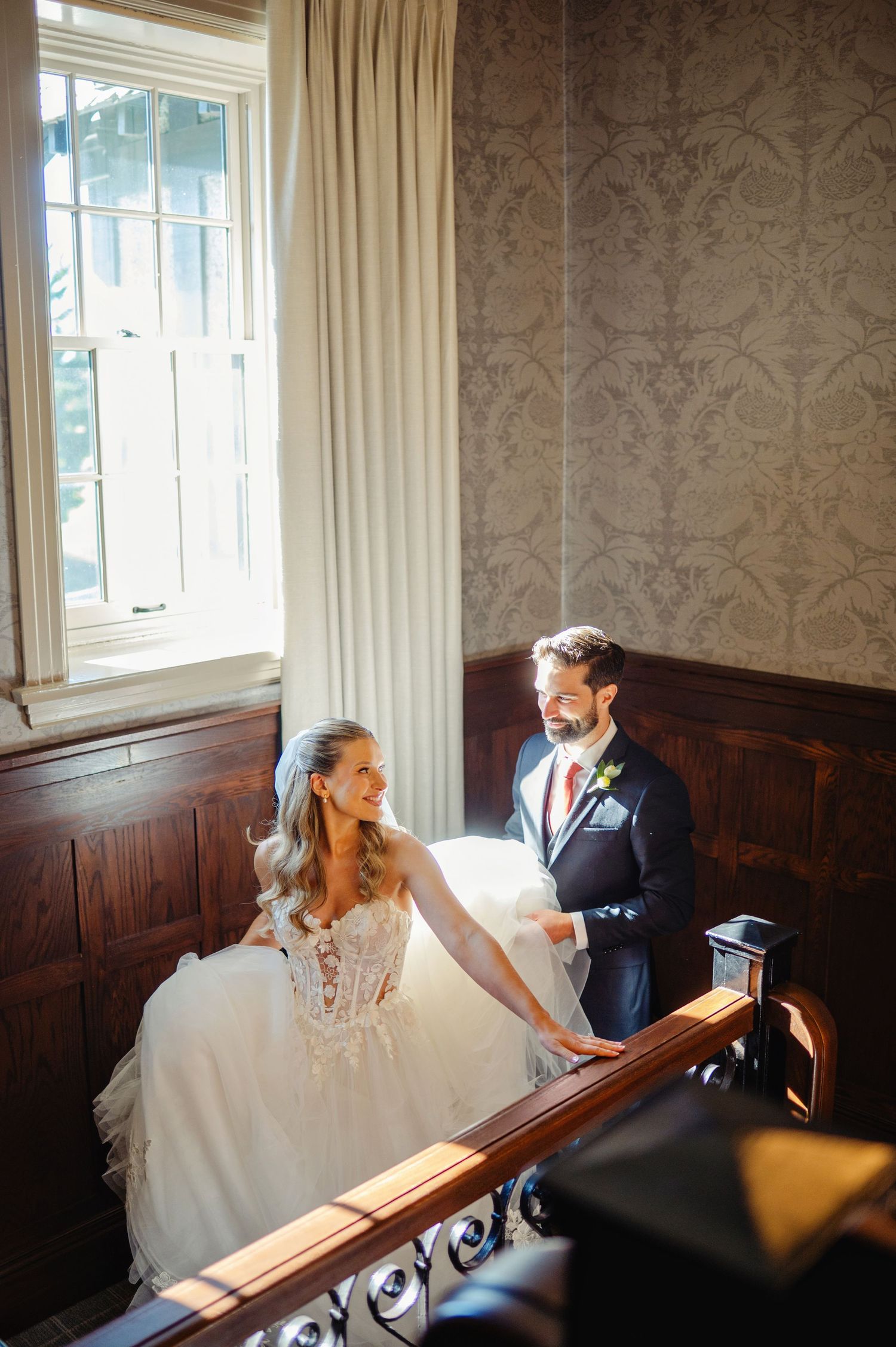 Bride and groom walking up stairs. Ottawa Wedding Photographer and Videographer