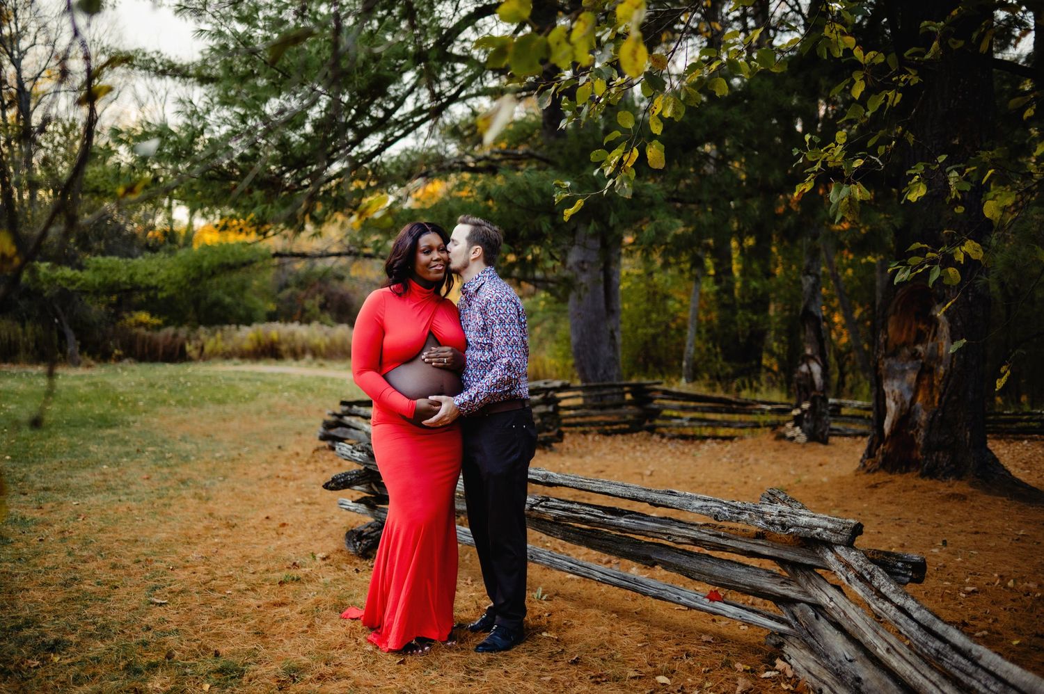 Husband kissing wife while holding baby belly. Ottawa Maternity Photography. Ottawa Family Photographer.