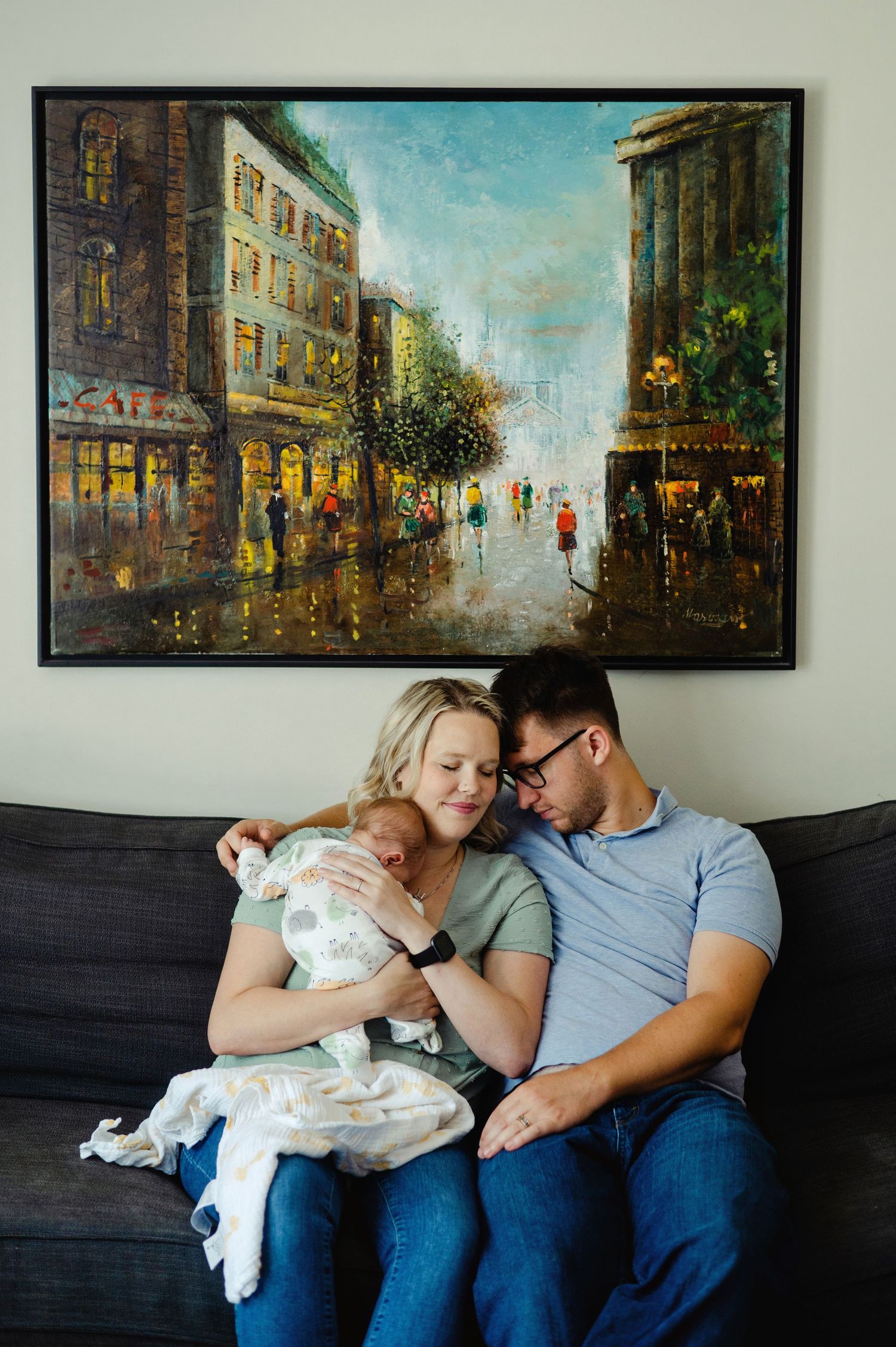 Mom holding newborn son while dad snuggles in. Ottawa Newborn Photography. Ottawa Family Photography