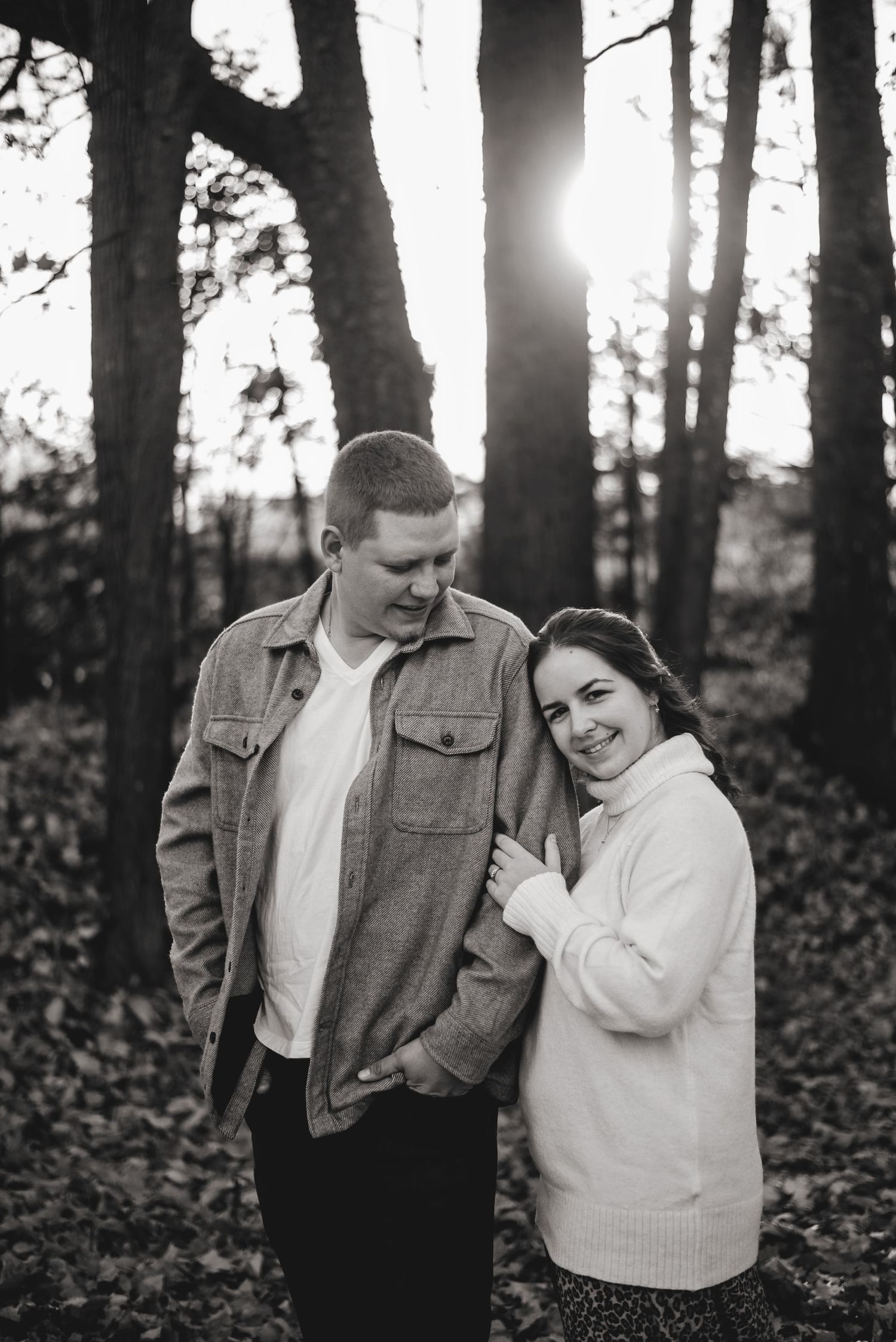 Fiancé cuddled into soon to be husbands shoulder by sunset. Ottawa Wedding Photographer. Ottawa Couples Photographer