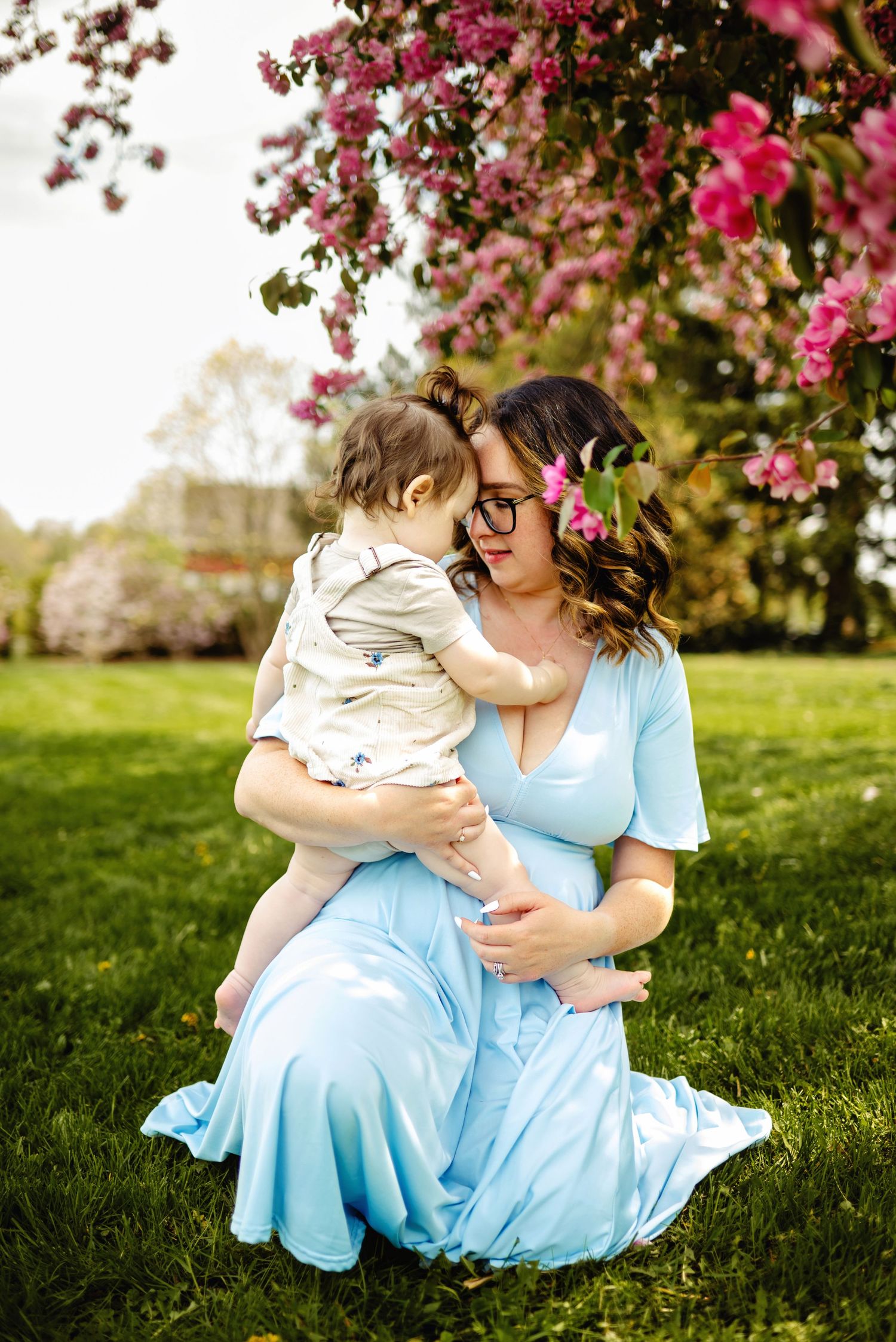 Mom holding baby touching foreheads. Ottawa Family Photographer