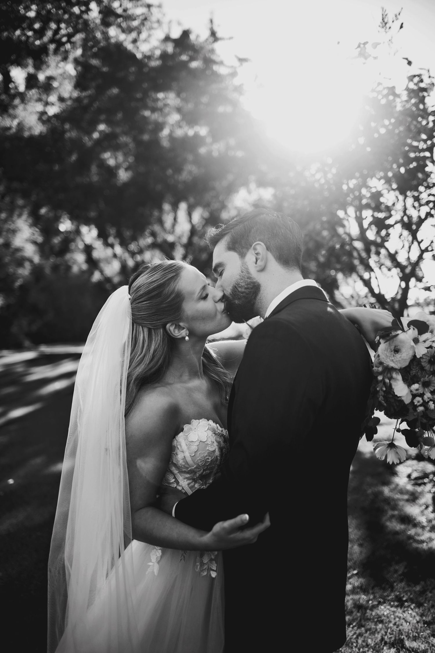 Bride and Groom kissing in sunset. Ottawa Wedding Photography. Ottawa Wedding Videography.