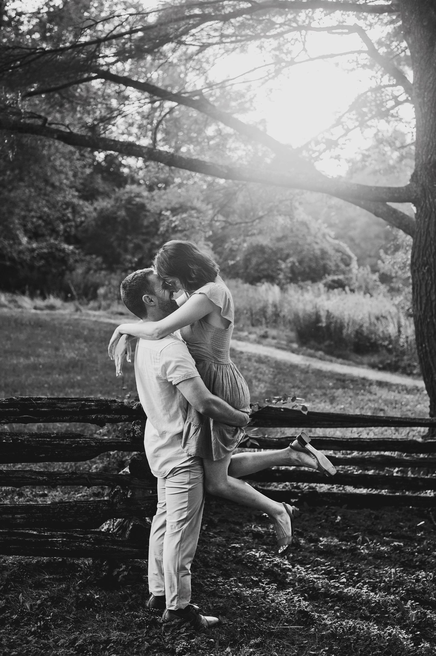Soon to be husband picking up Fiancé and kissing her during sunset. Ottawa Wedding Photographer. Ottawa Couples Photographer