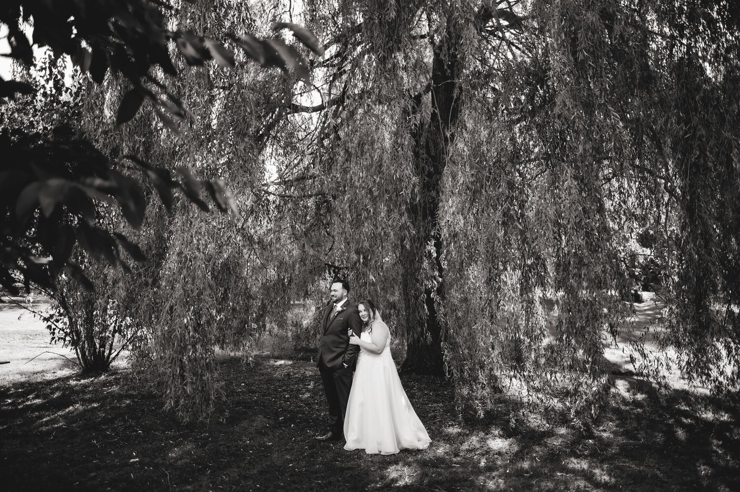 Bride cuddled into groom. Ottawa Wedding Photographer and Videographer