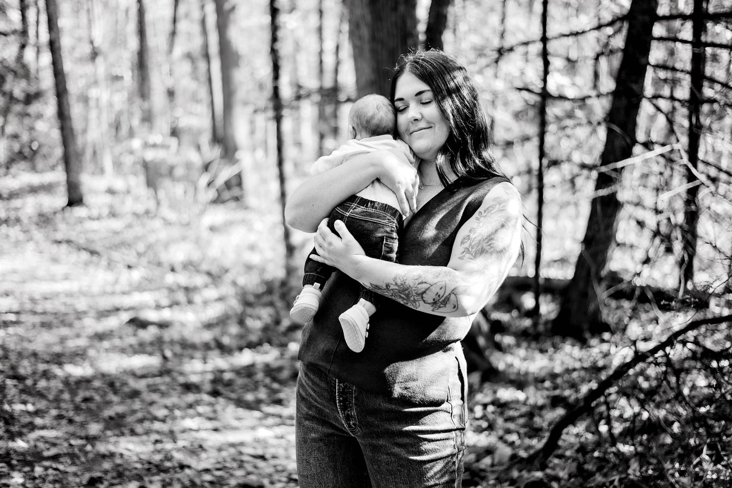 Mom holding baby son against her chest. Ottawa Family Photography.