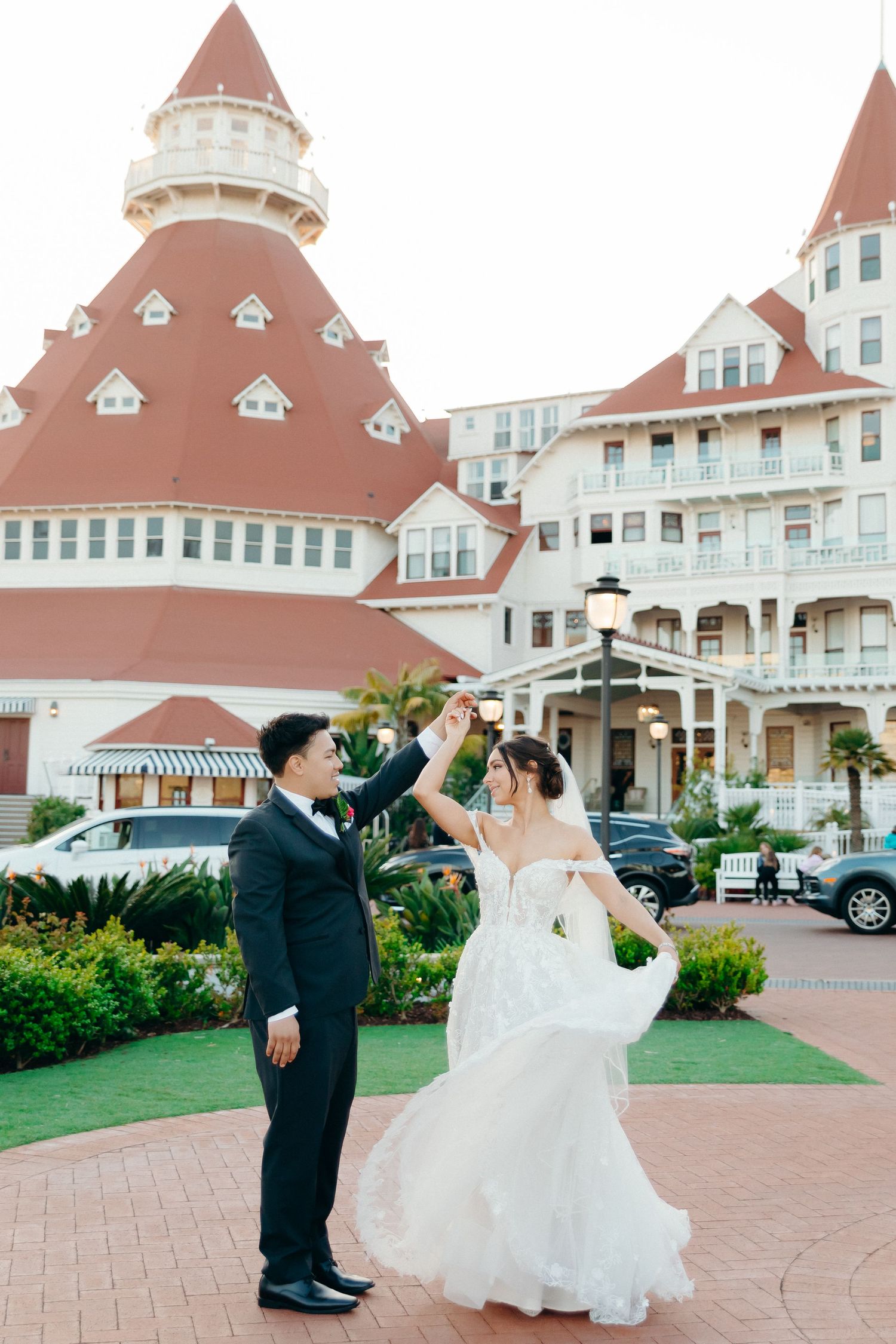 A romantic wedding dance moment in front of the iconic Hotel del Coronado in San Diego.