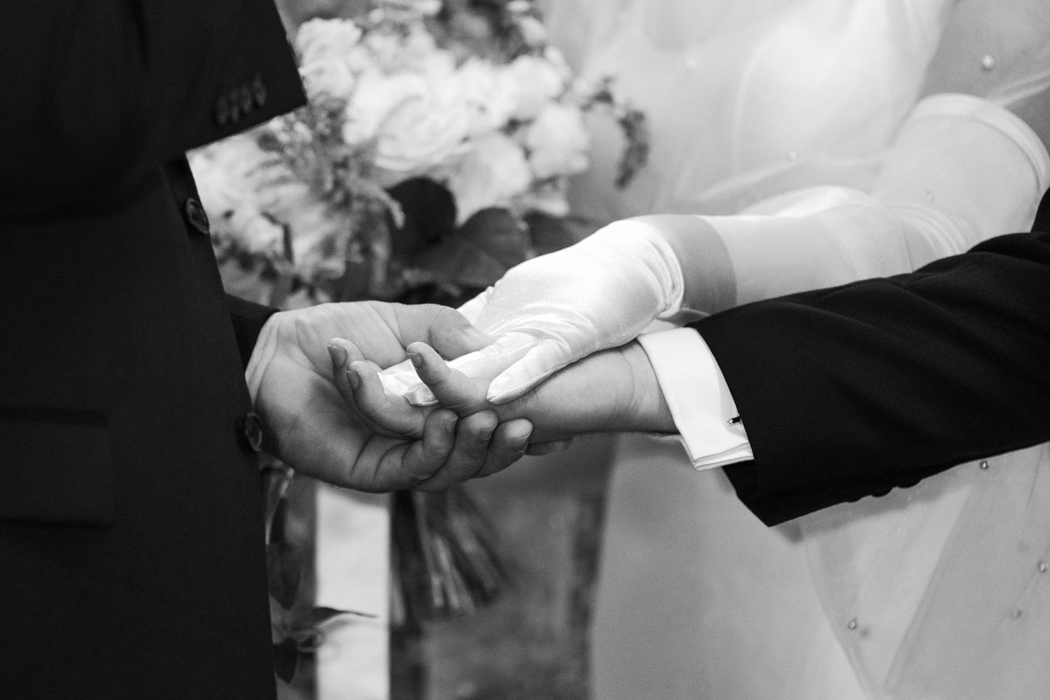 wedding couple hands united at the alter during ceremony