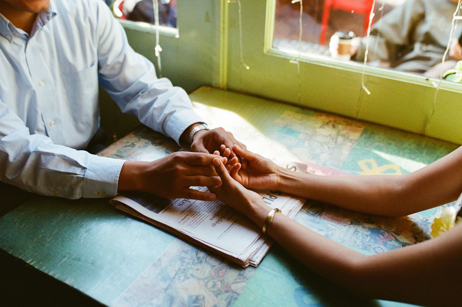 a close up shot of couple hands captured on  film