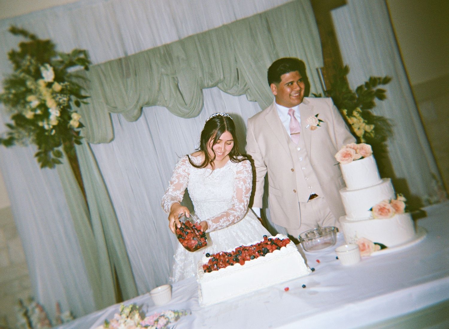 a couple cutting the cake captured on holga film