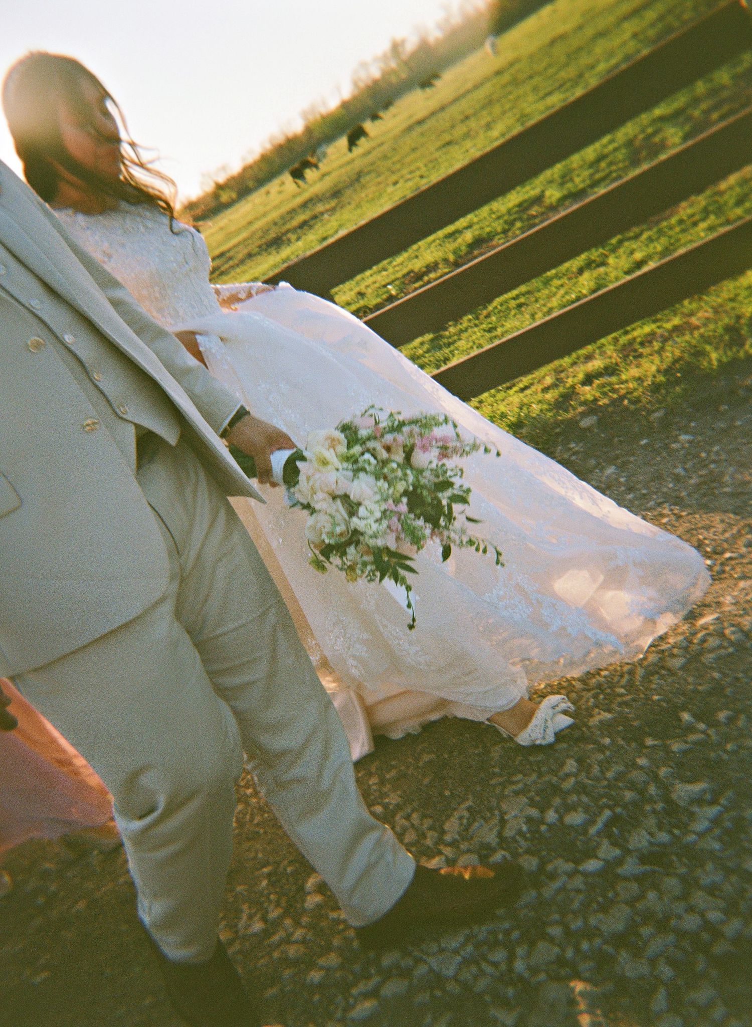 a couple walking in a ranch road captured on holga film
