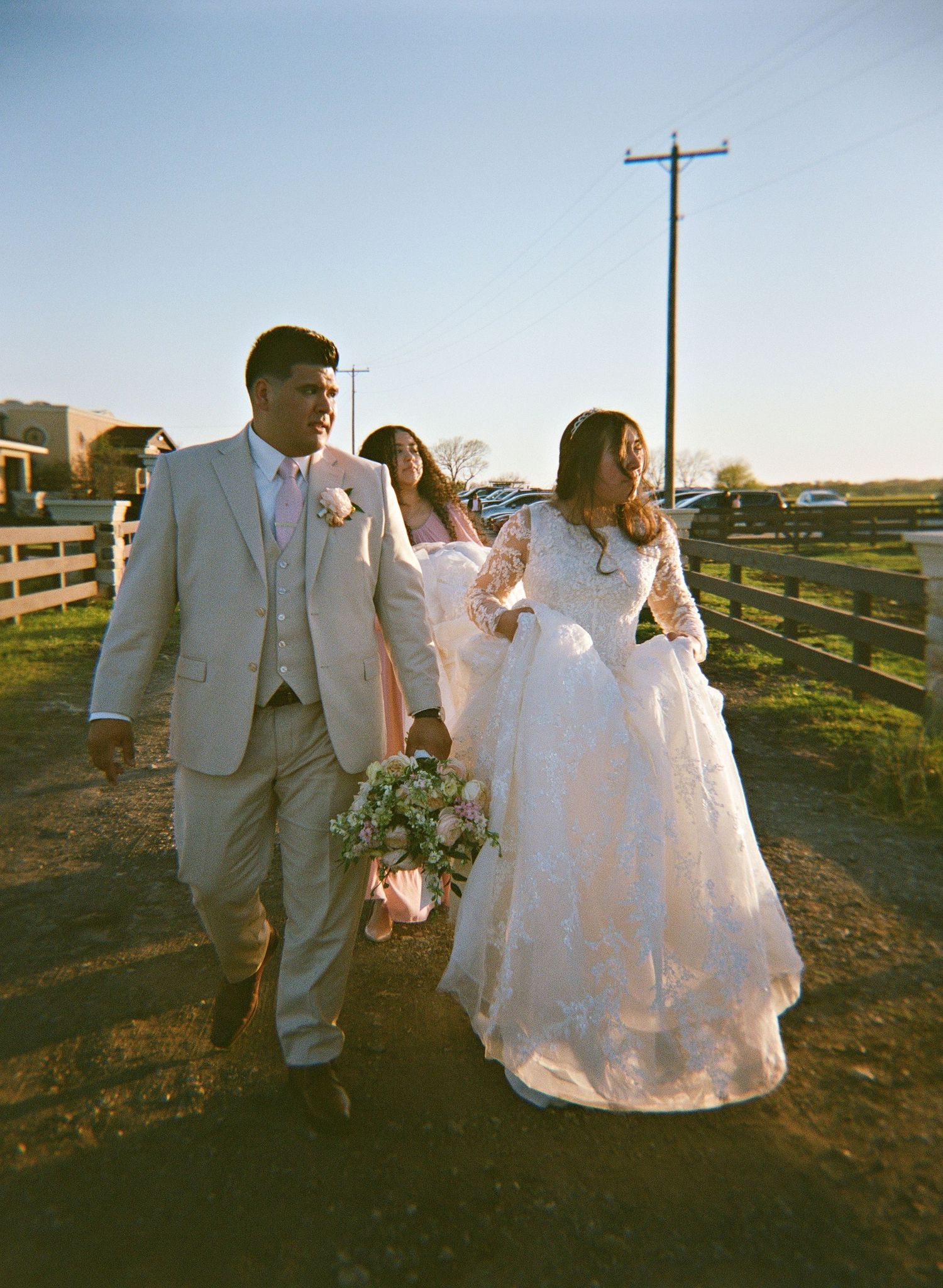 a couple walking in a ranch road captured on holga film