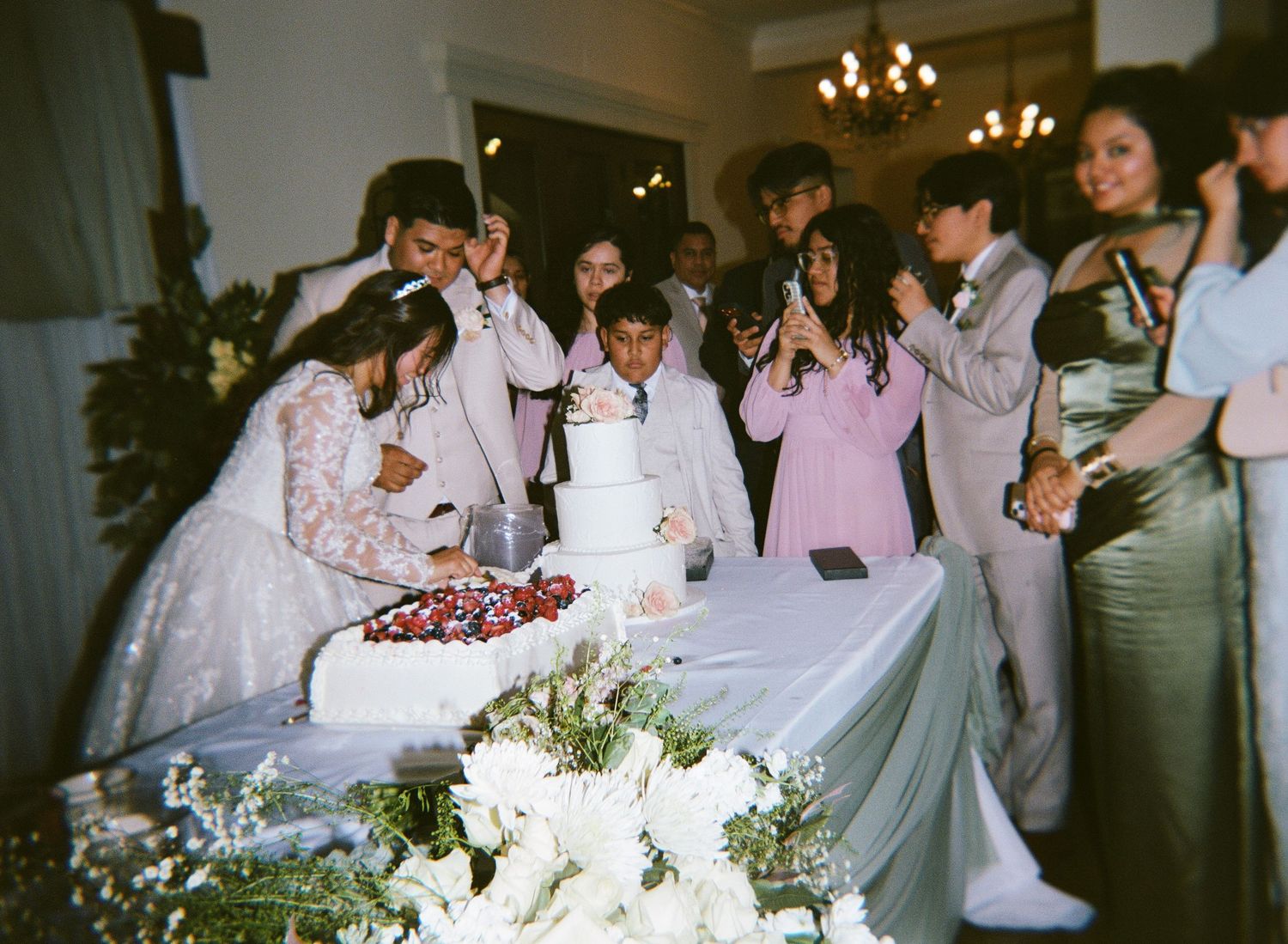 a couple cutting the cake captured on holga film