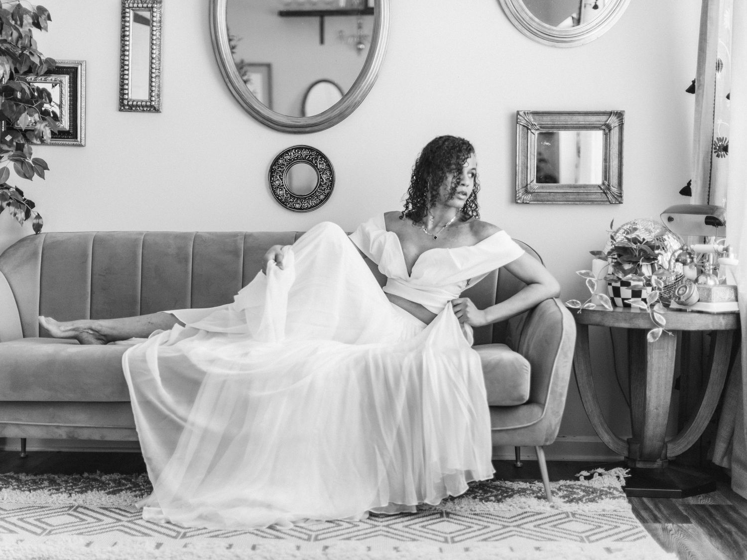 A photo of black and white wedding photos showing bridal gown preparations in vintage style settings.
