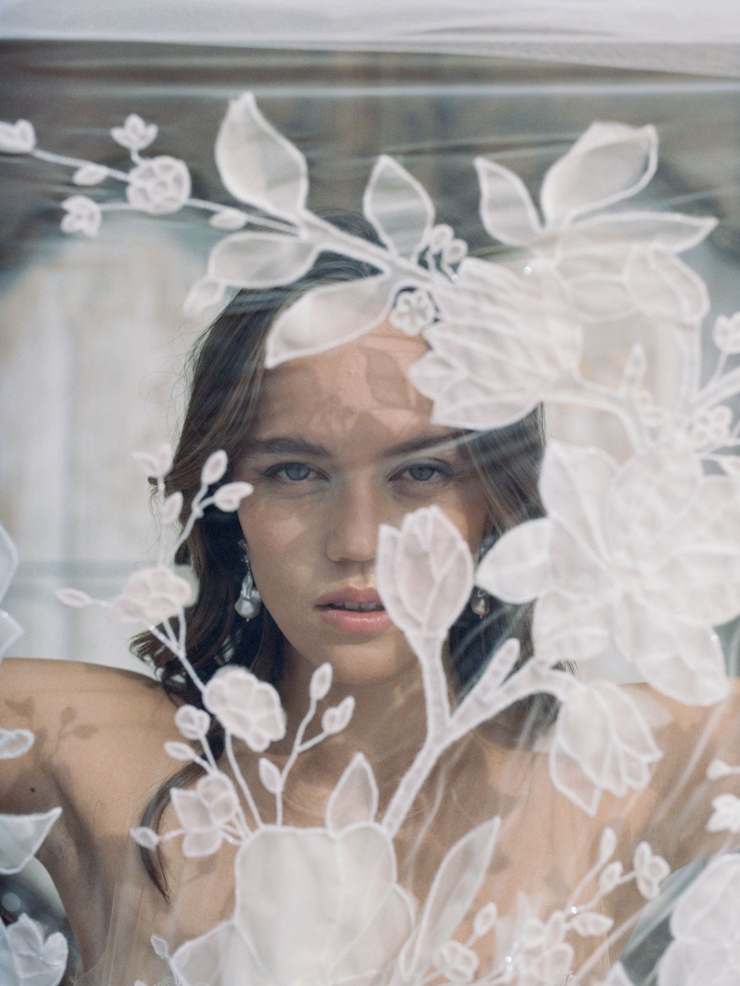 Woman's face through a floral embroidered veil — fine art boudoir session in New York by Heartmore Artistry