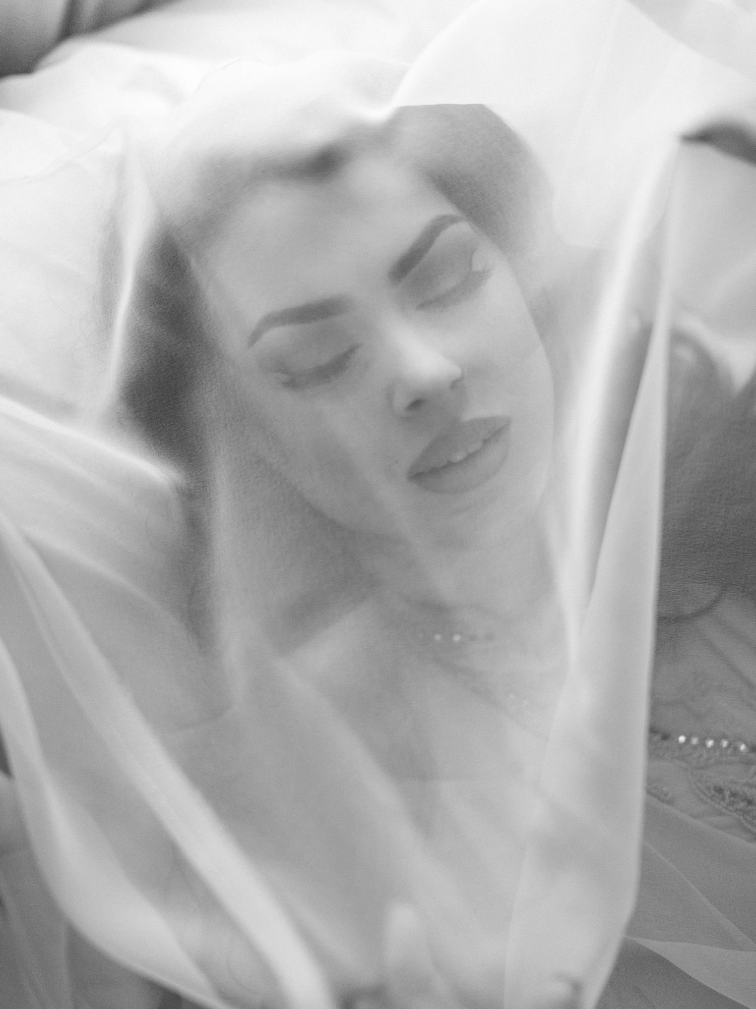 A photo of black and white close-up shots showing dreamy, ethereal expressions through soft focus and blurred motion.