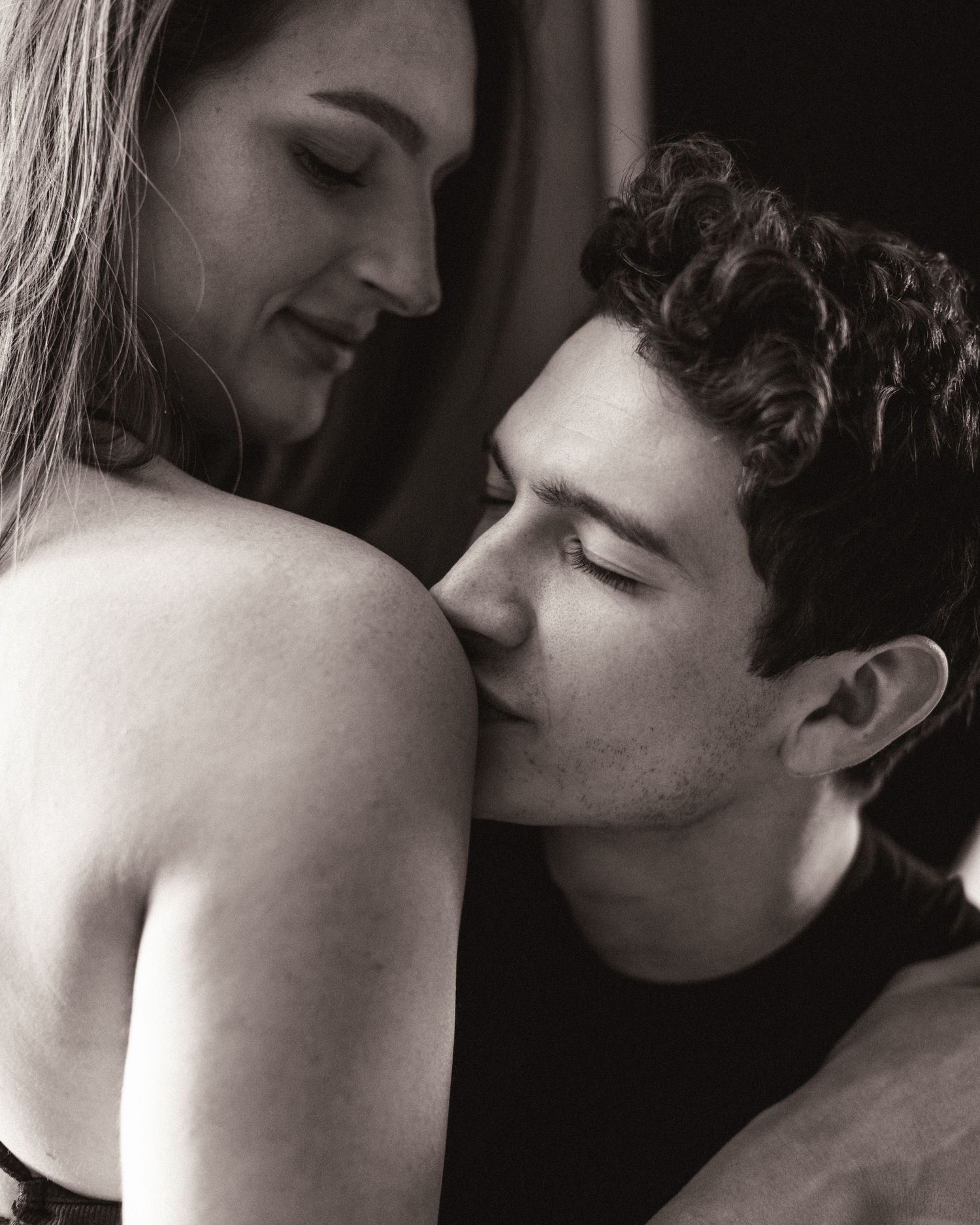 Series of black and white romantic images showing intimate close-up moments between two people.
