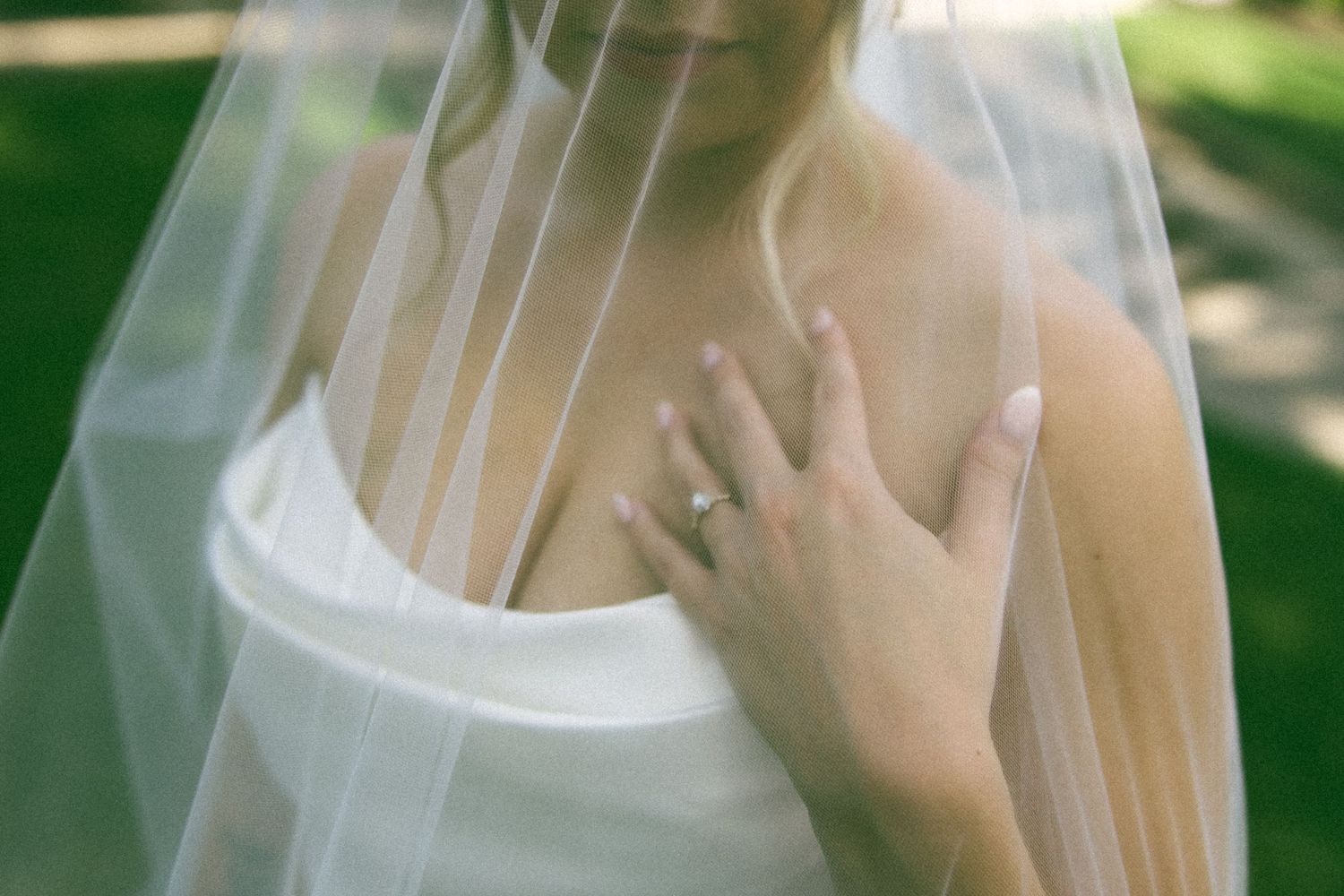 Delicate white tulle veil flowing in natural light.