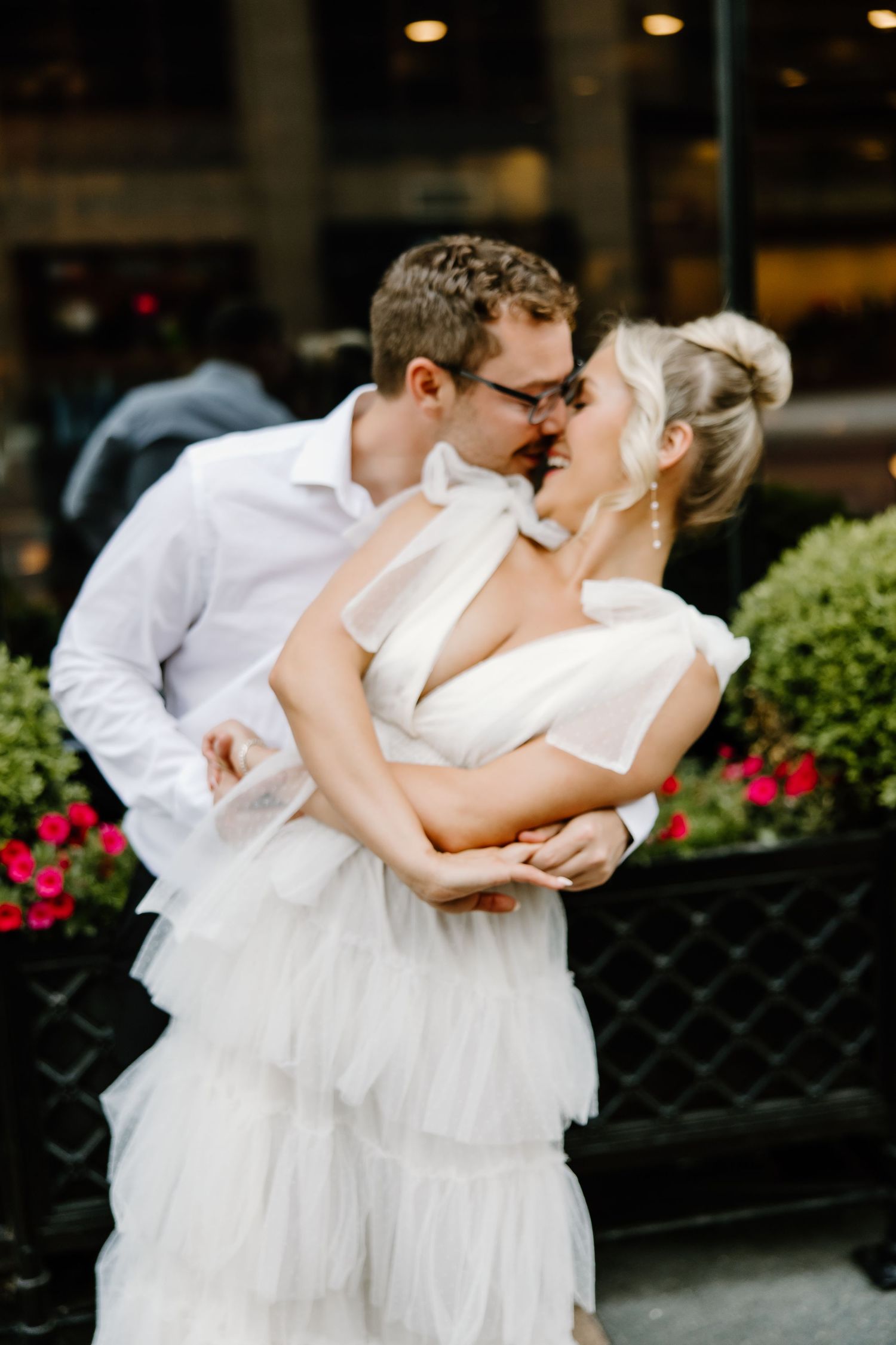Romantic moment between couple near flowering garden.