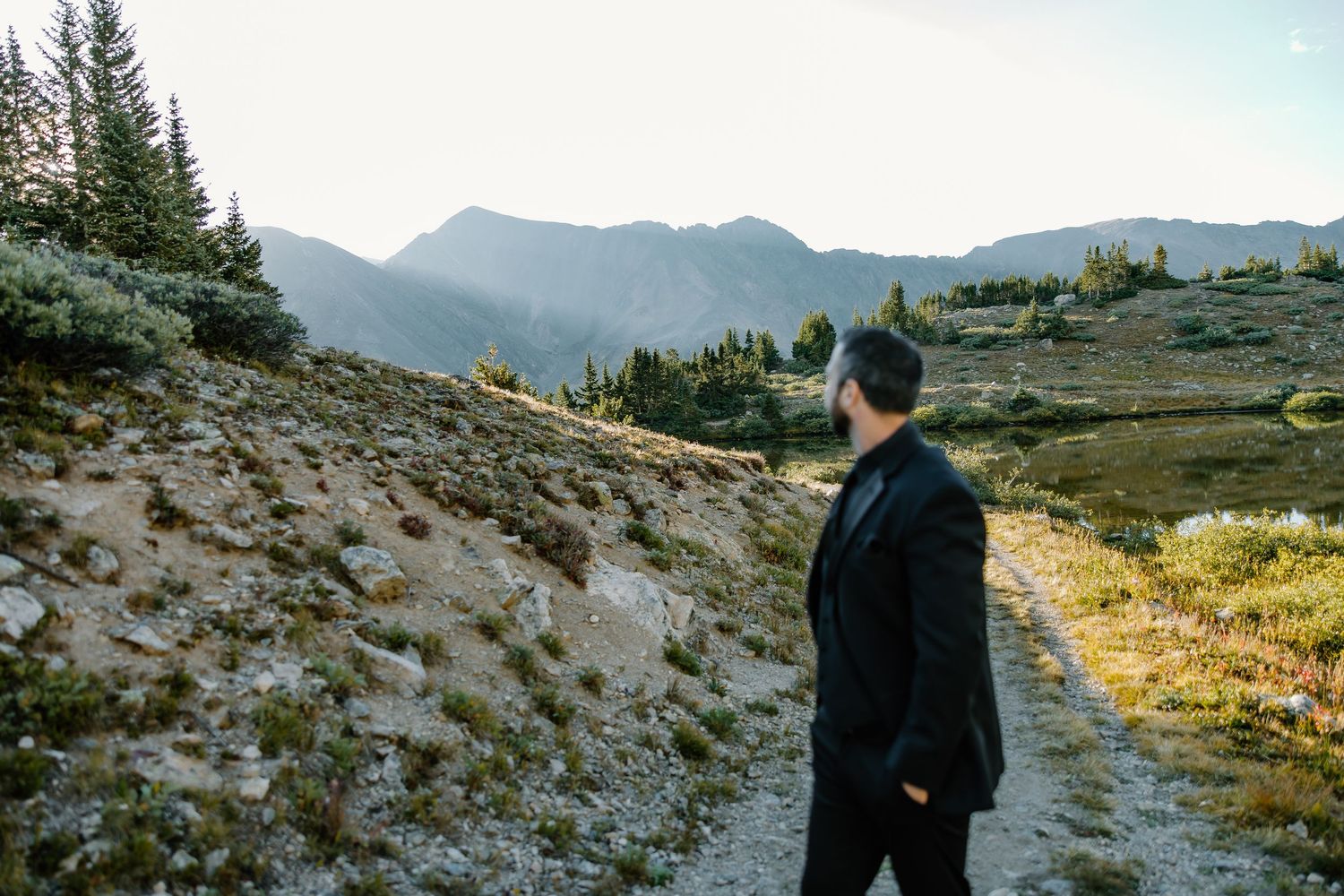 Mountain landscape with evergreen trees and rocky terrain for outdoor wedding.