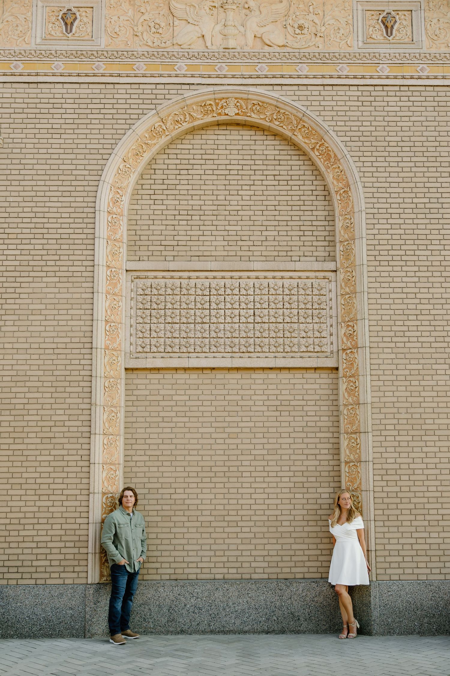 Architectural series showing ornate arches and brick walls with couples posing in each frame.