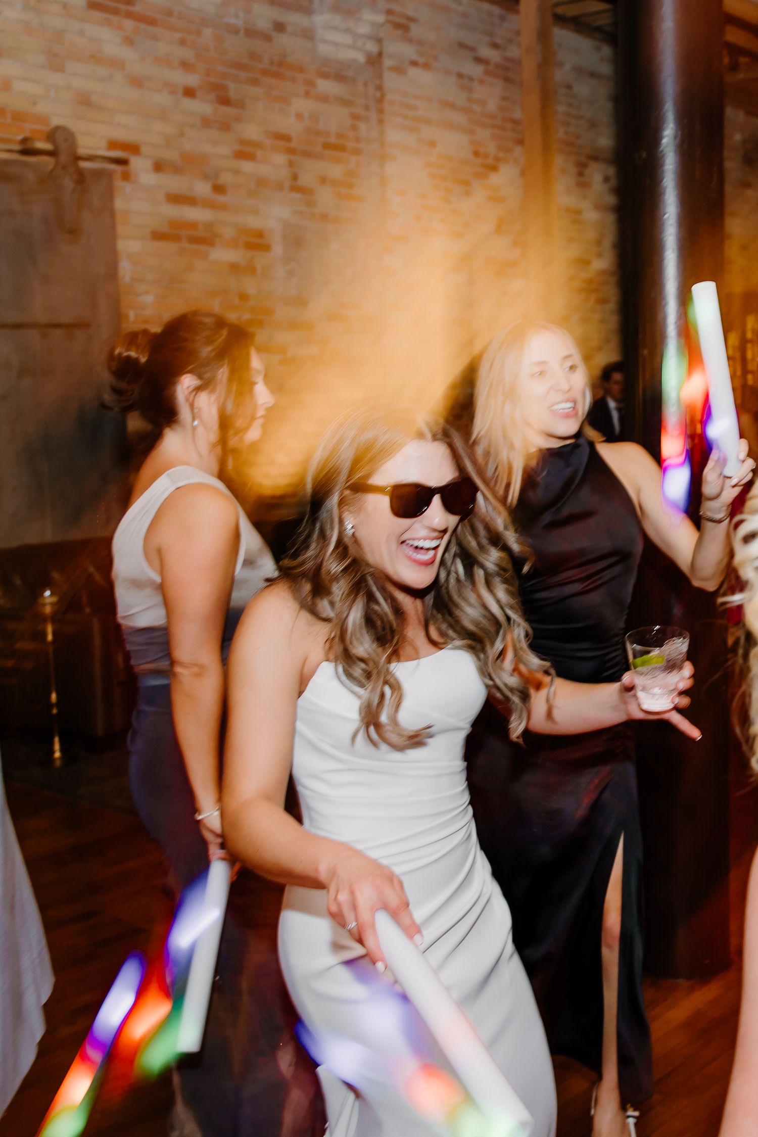 Energetic dance party sequence with colorful light effects on dance floor.