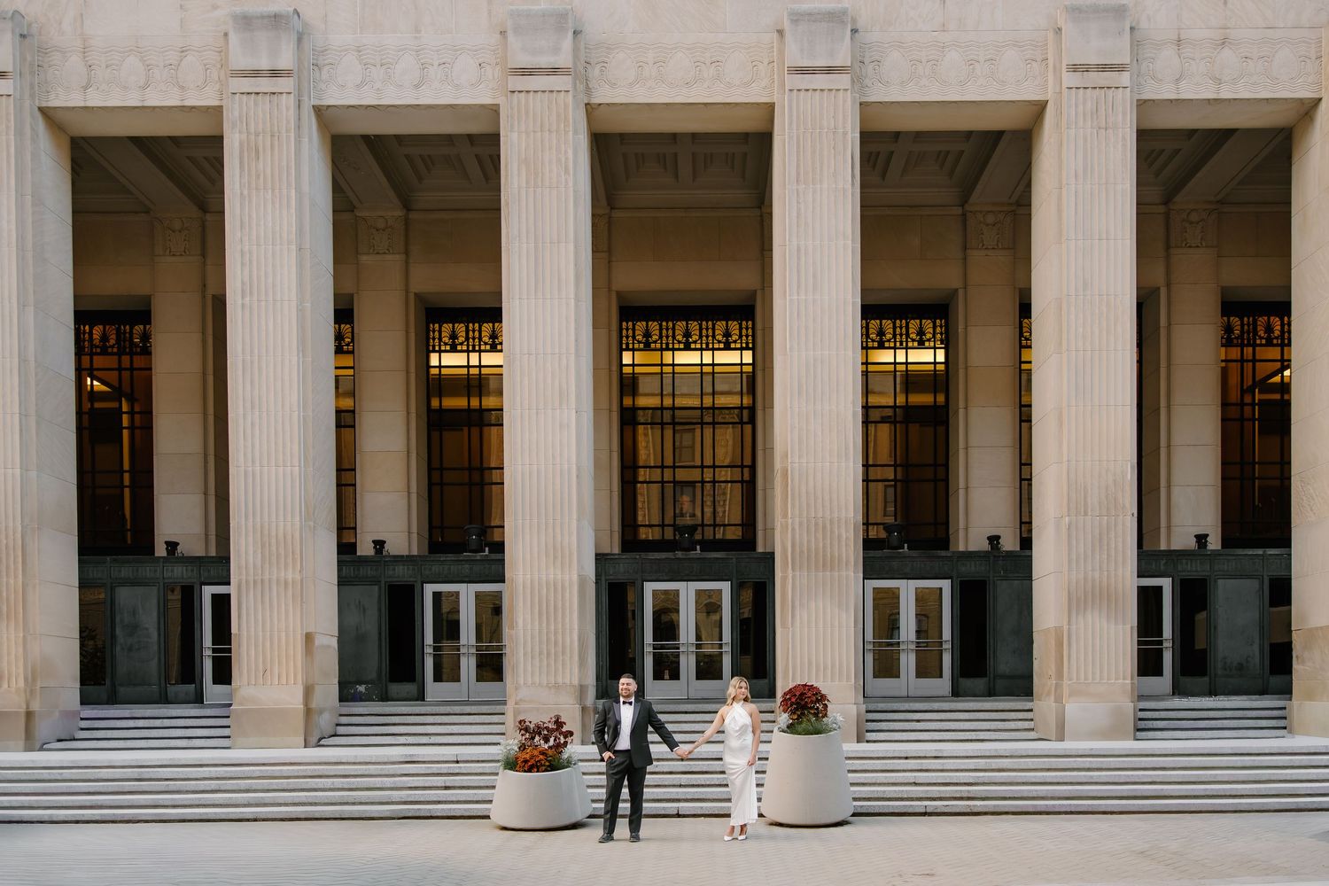 Wide architectural shot of historic building with columns and stairs.
