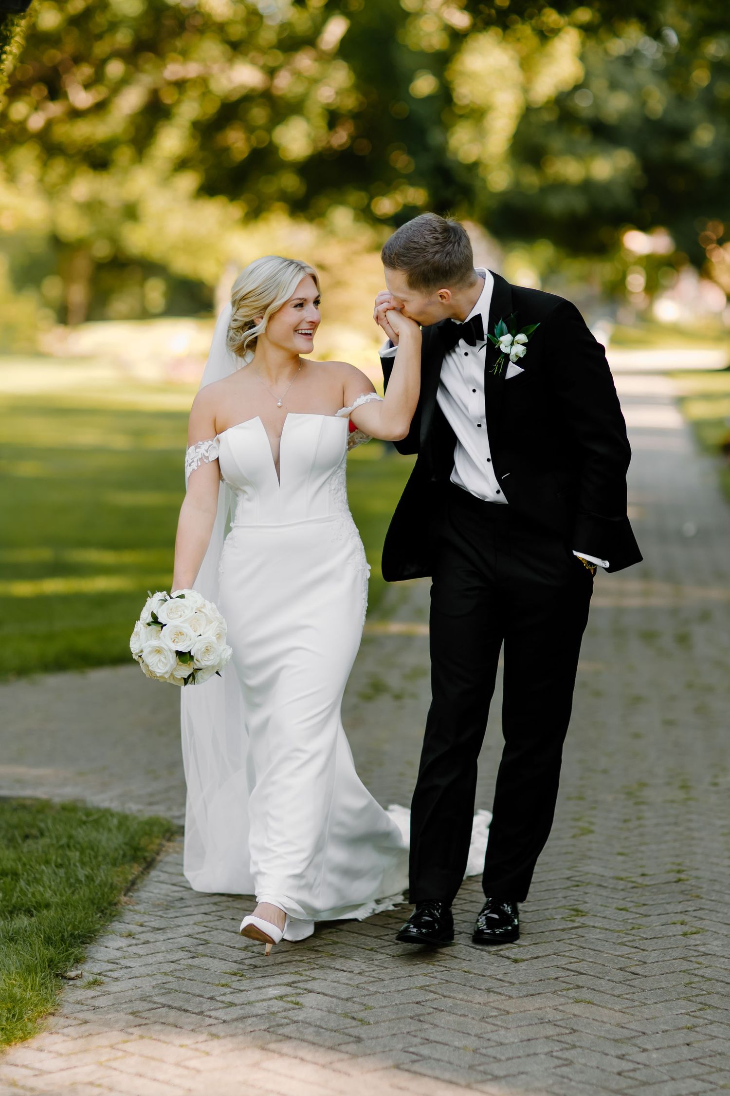 Creative wedding photo series showing couple's playful interaction on brick pathway.