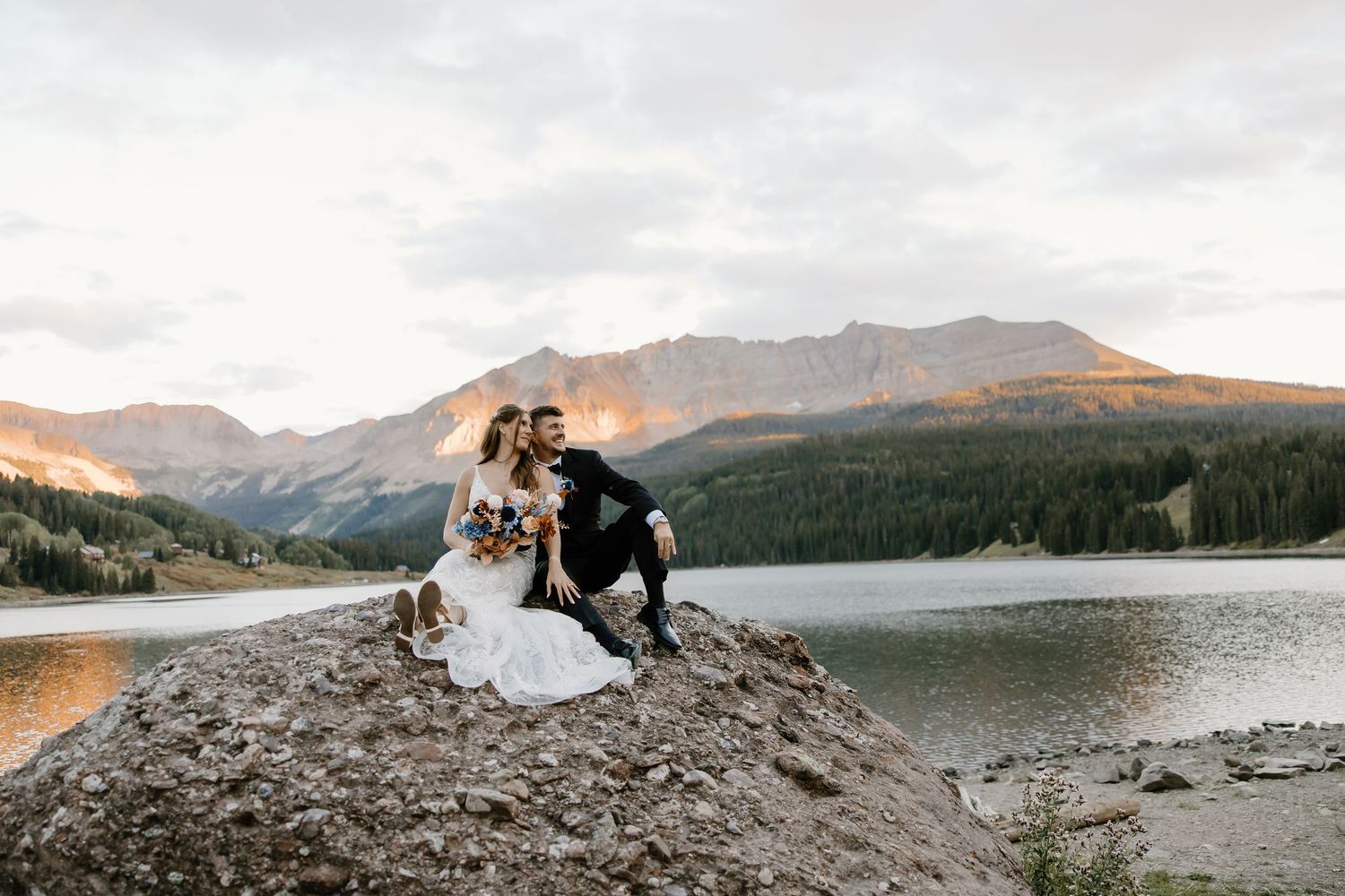 Scenic mountain wedding photography with dramatic peaks and pristine lake views.