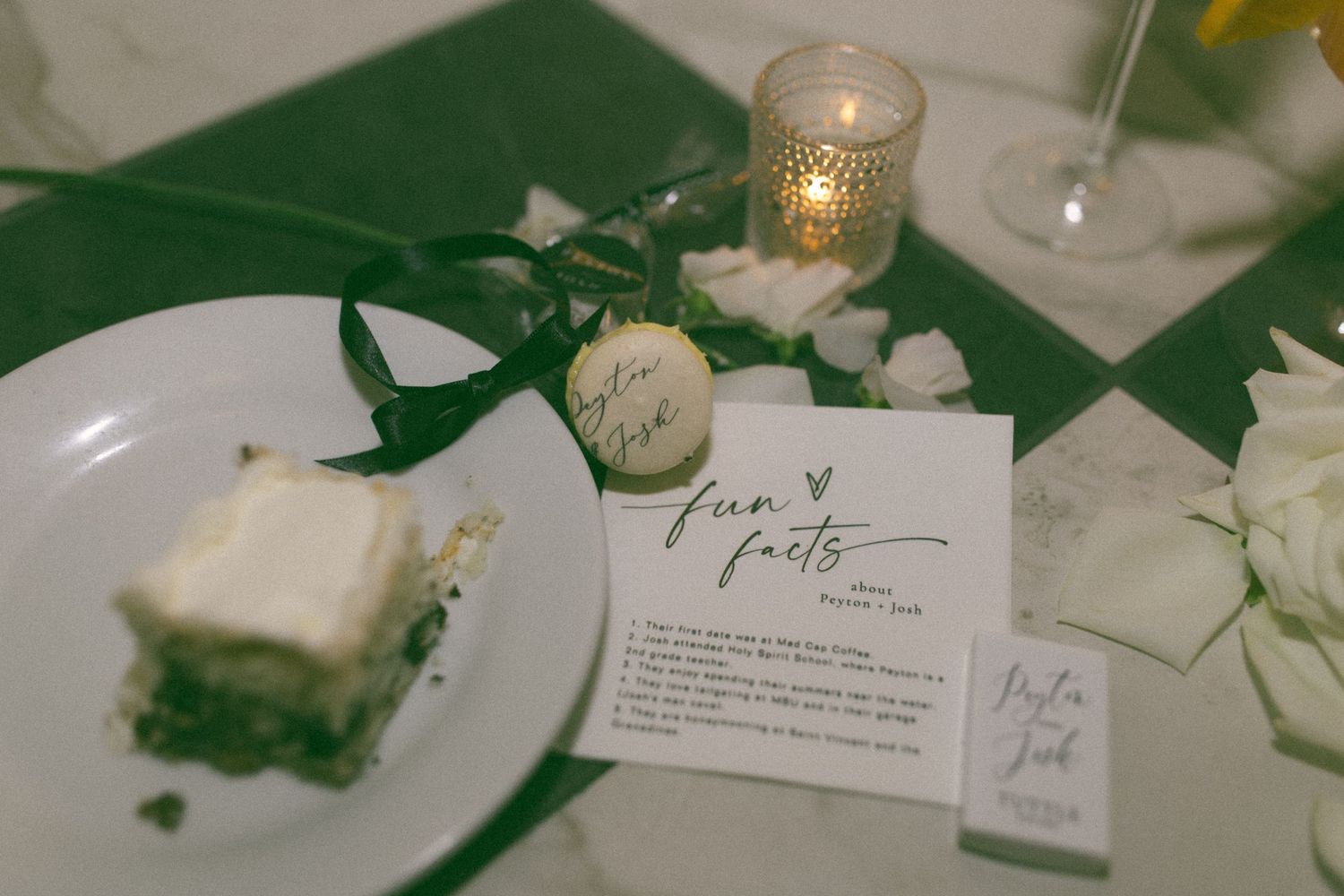 Elegant wedding table settings with green accents and candlelight.