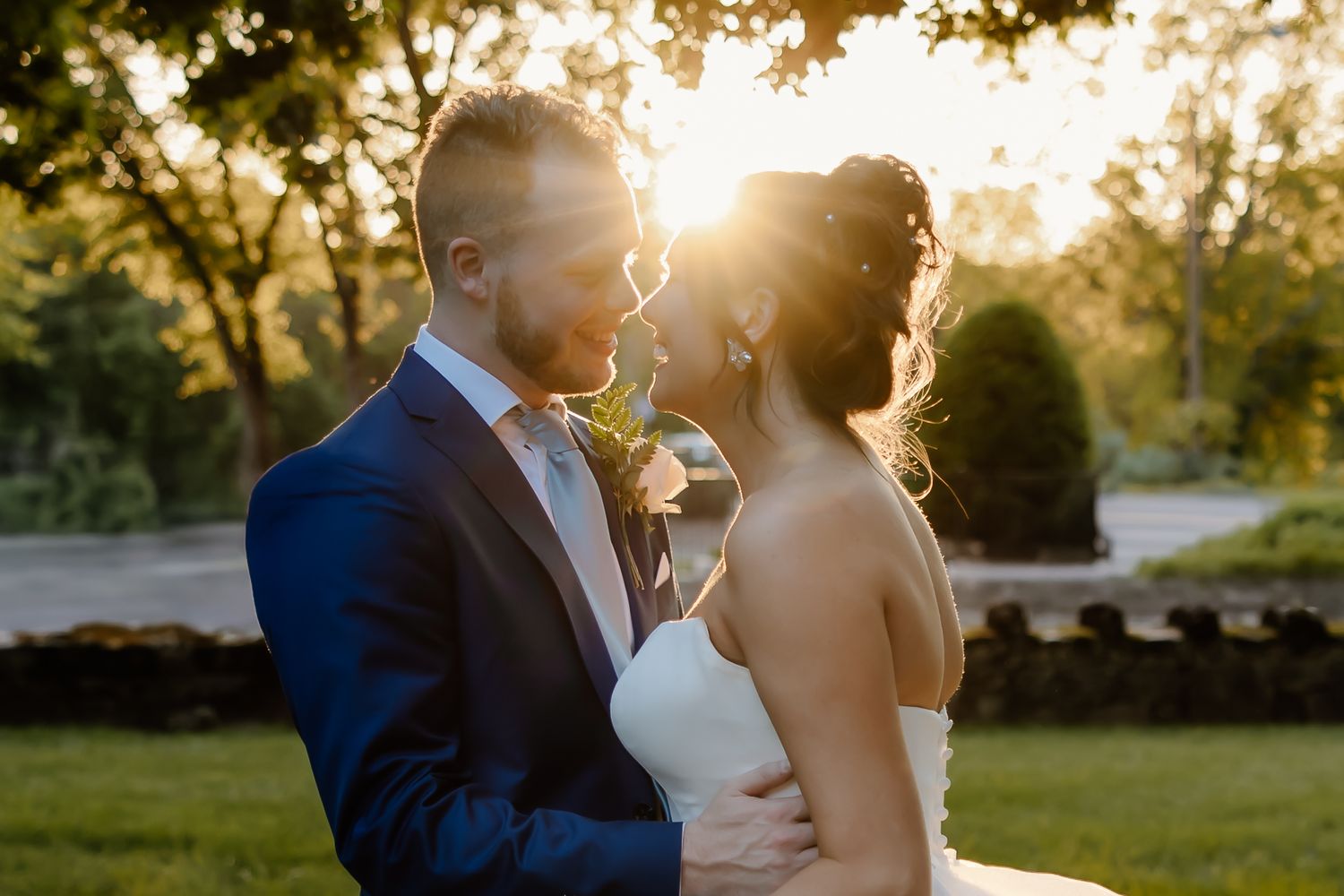 Golden hour wedding portraits with dramatic sunset lighting.