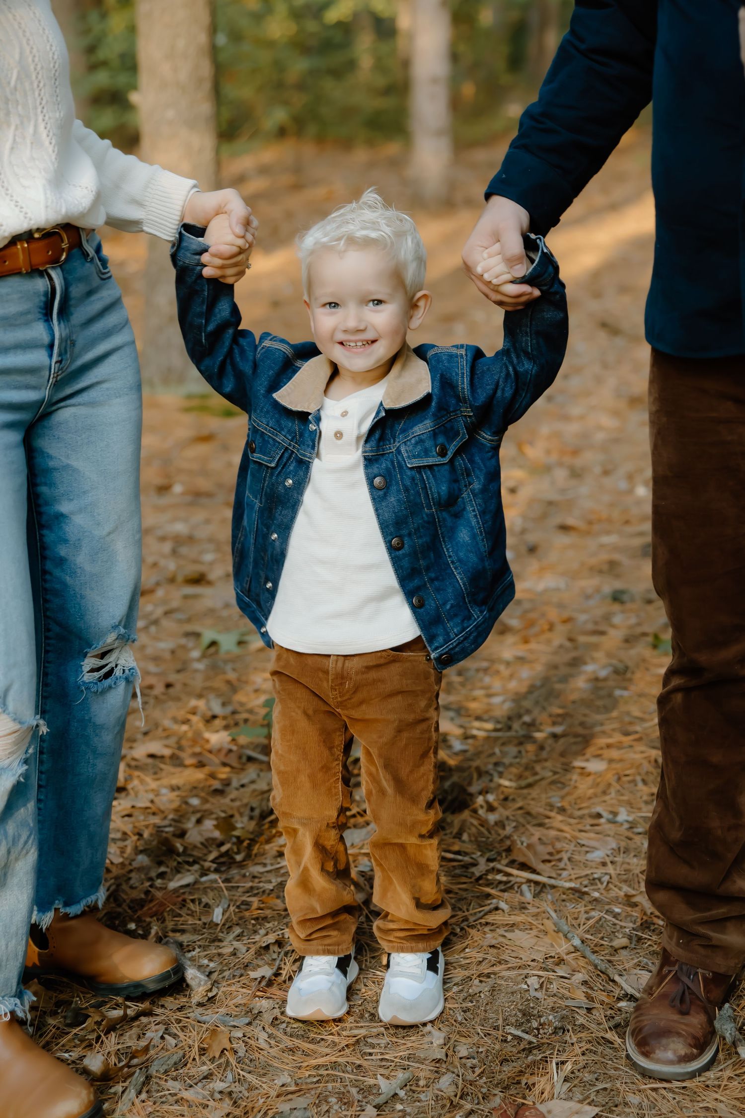 Close-up detail shots of family members' casual autumn outfits and interactions.