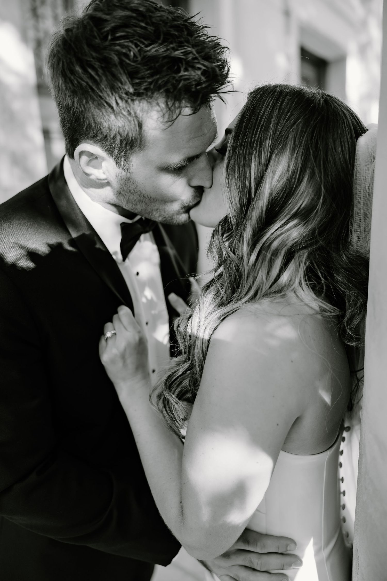 Black and white photo series capturing tender moments between newlyweds.