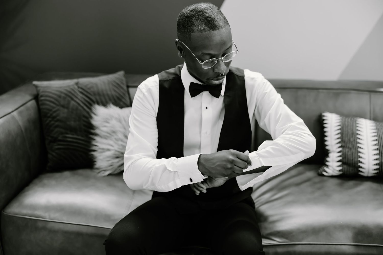 Black and white candid moments during wedding preparations.