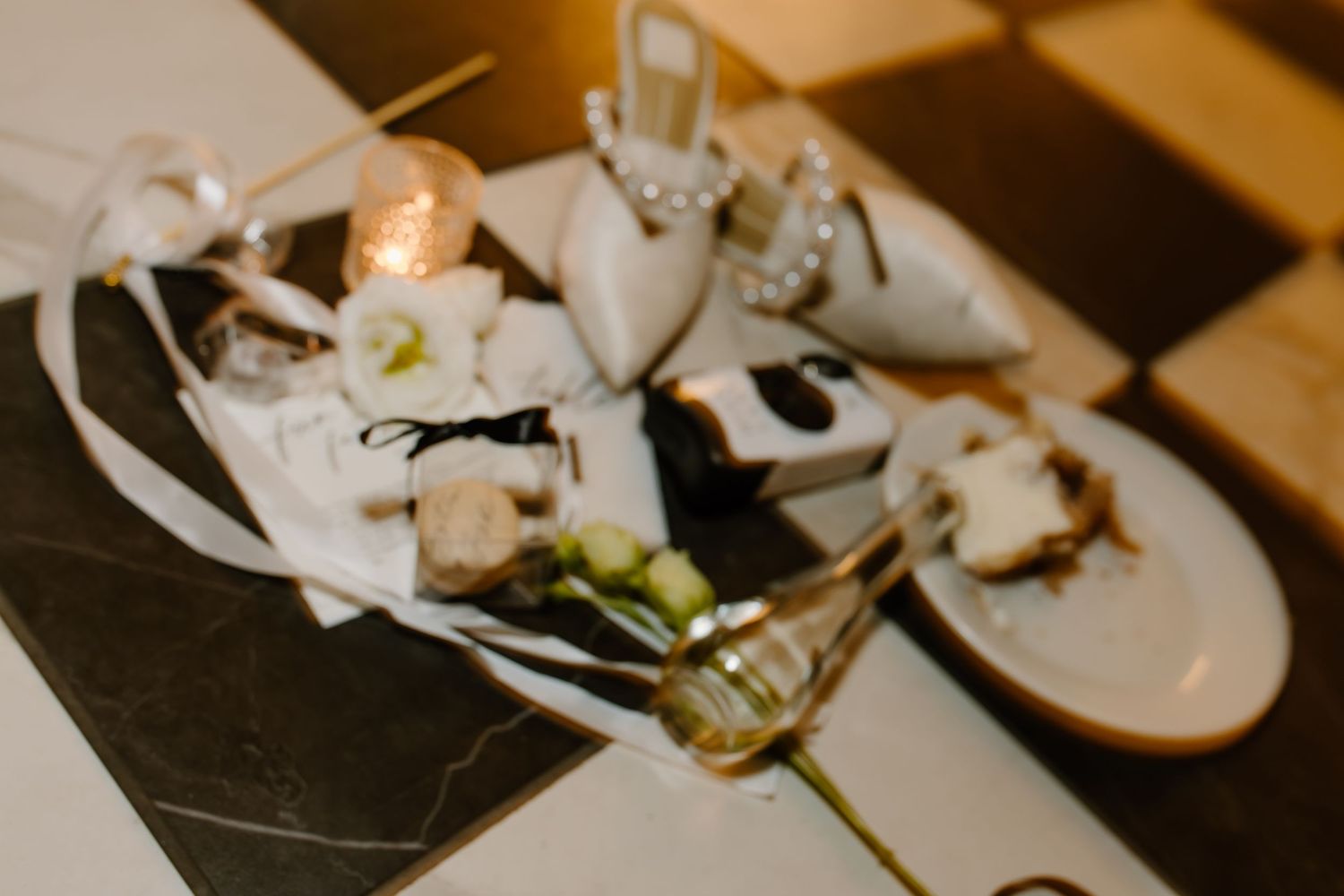 Wedding reception table details with place cards and decorative elements.