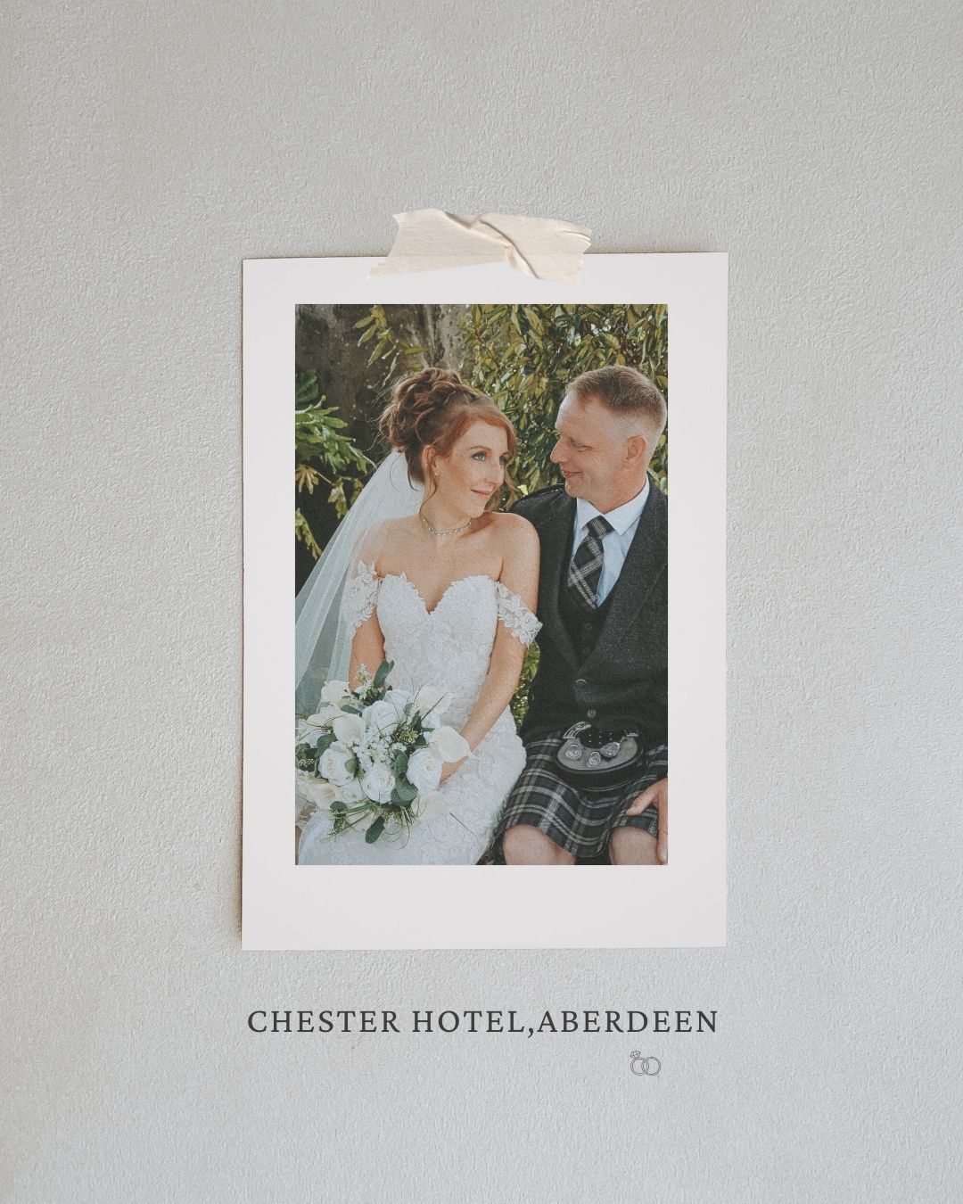 Wedding couple poses together at Chester Hotel in Aberdeen with elegant white floral bouquet and formal attire.