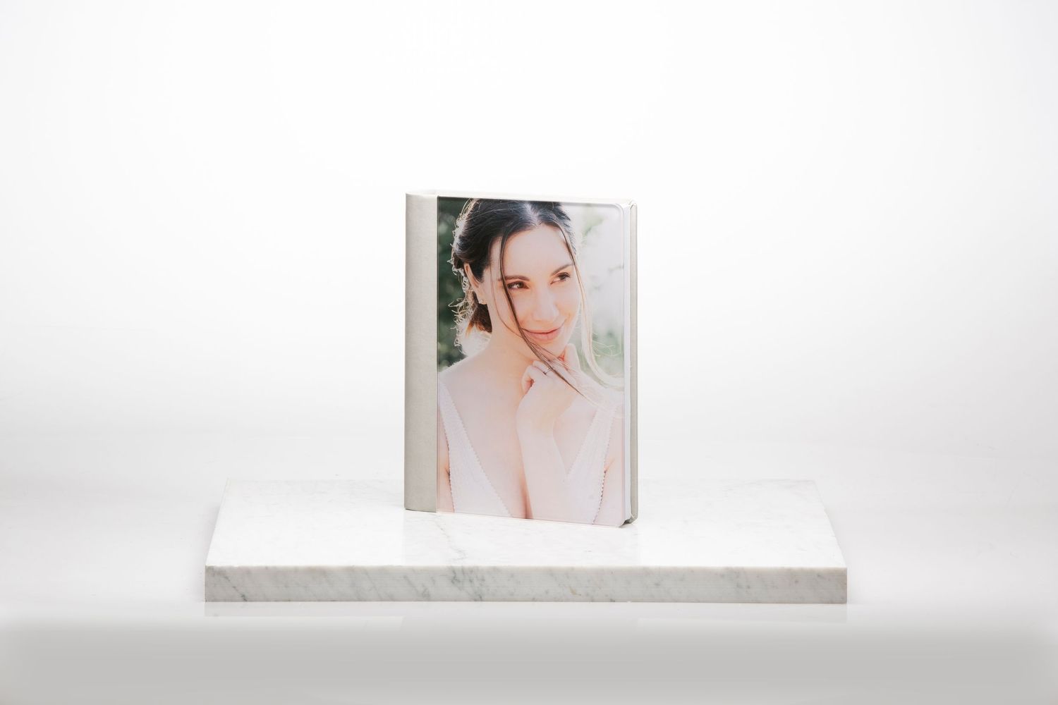 A series of small polaroid-style photographs arranged in a row against a light gray background.