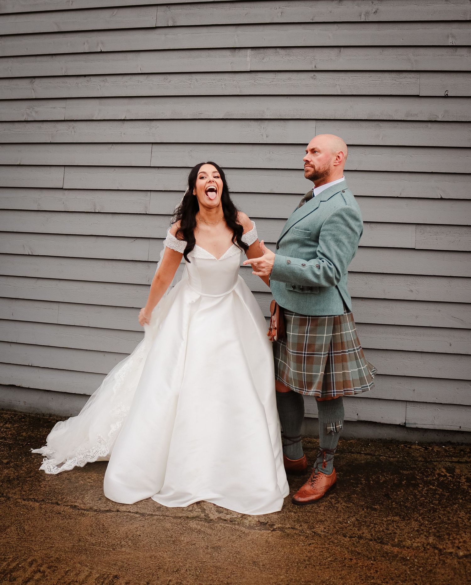 A series of playful wedding photos showing a bride in white dress and groom in a kilt posing against a gray wall.