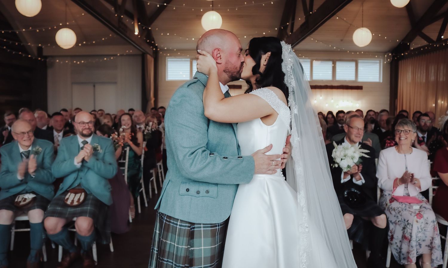 A romantic wedding reception dance sequence showing five moments of a couple's first dance together.