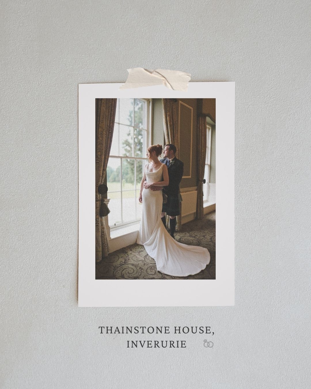 A wedding couple stands by large windows at Thainstone House in Inverurie,   Aberdeen-wedding-photographer-Thainstone House