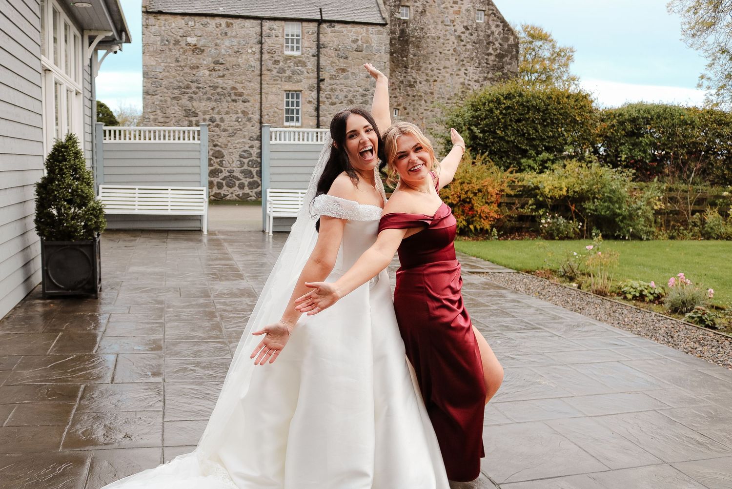 A sequence of joyful wedding photos showing celebrations on a stone patio with scenic countryside backdrop.