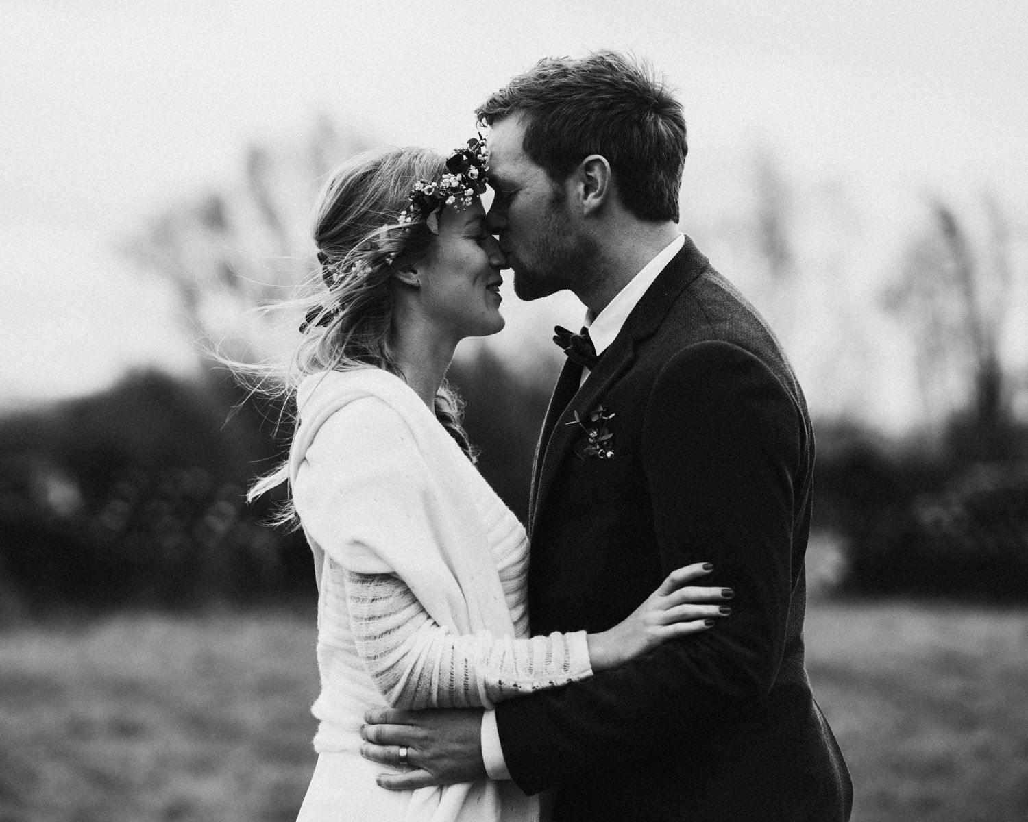 Black and white wedding portrait series showing intimate moments between newlyweds.